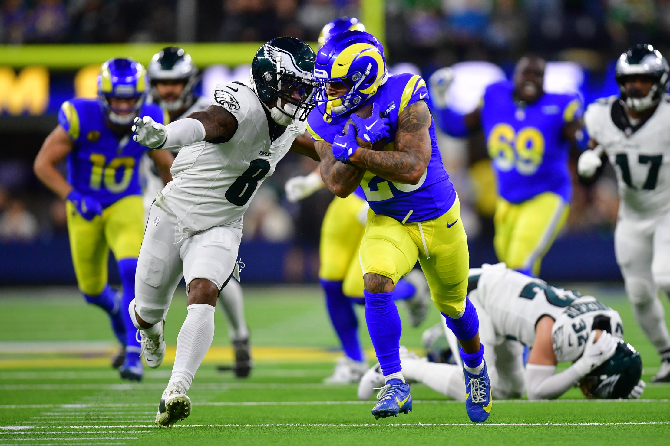 Nov 24, 2024; Inglewood, California, USA; Philadelphia Eagles safety C.J. Gardner-Johnson (8) moves in against Los Angeles Rams running back Kyren Williams (23) during the first half at SoFi Stadium. Mandatory Credit: Gary A. Vasquez-Imagn Images