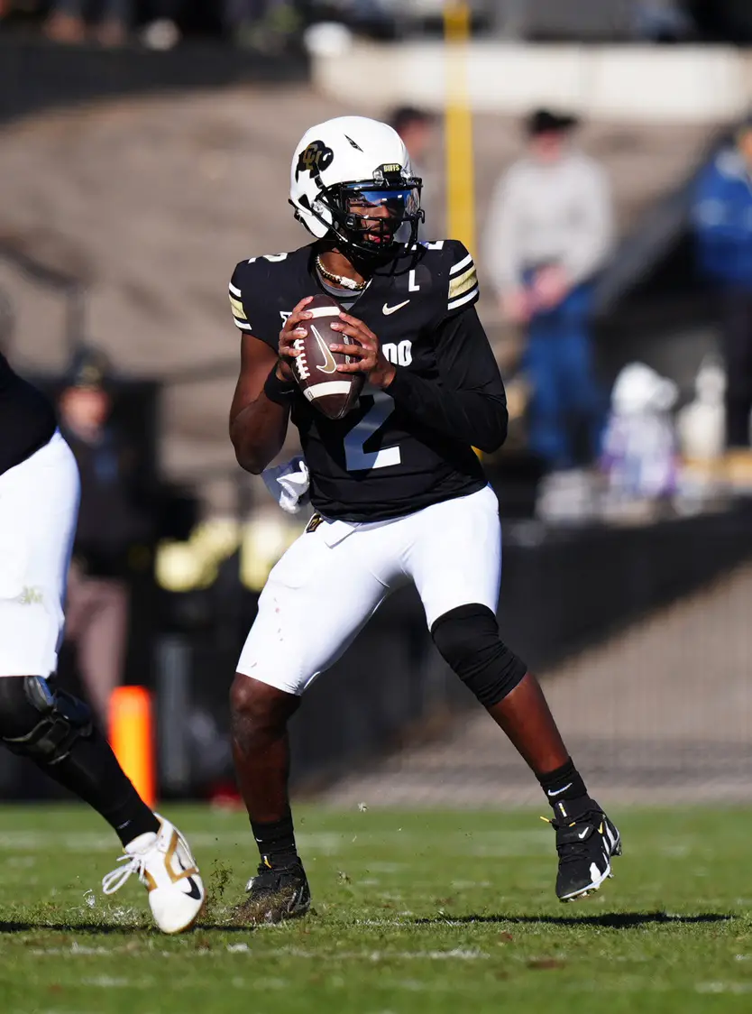 Nov 29, 2024; Boulder, Colorado, USA; Colorado Buffaloes quarterback Shedeur Sanders (2) prepares to pass in the second quarter against the Oklahoma State Cowboys at Folsom Field. Mandatory Credit: Ron Chenoy-Imagn Images (Giants)