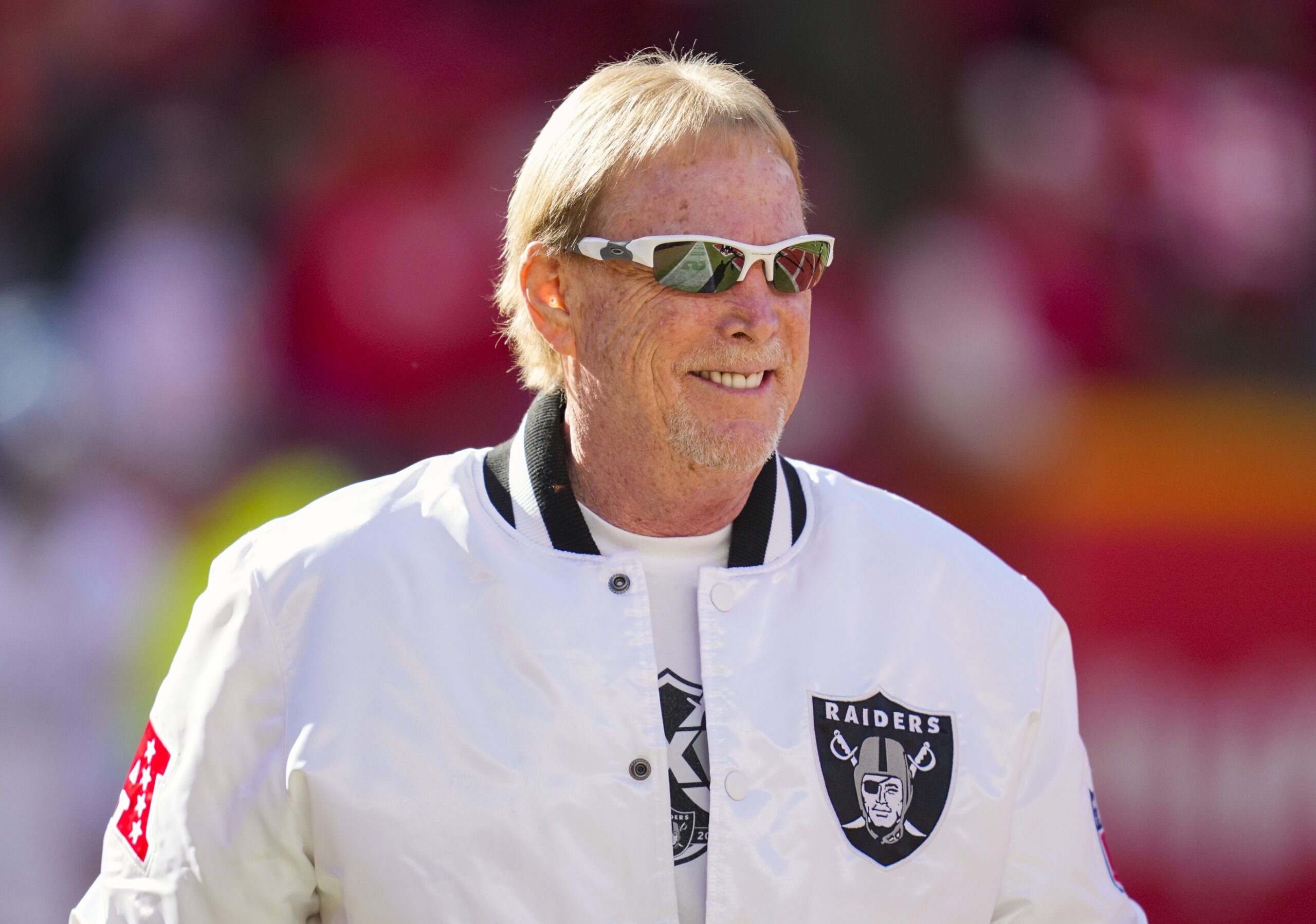 Nov 29, 2024; Kansas City, Missouri, USA; Las Vegas Raiders owner Mark Davis takes the field prior to a game against the Kansas City Chiefs at GEHA Field at Arrowhead Stadium. Mandatory Credit: Jay Biggerstaff-Imagn Images