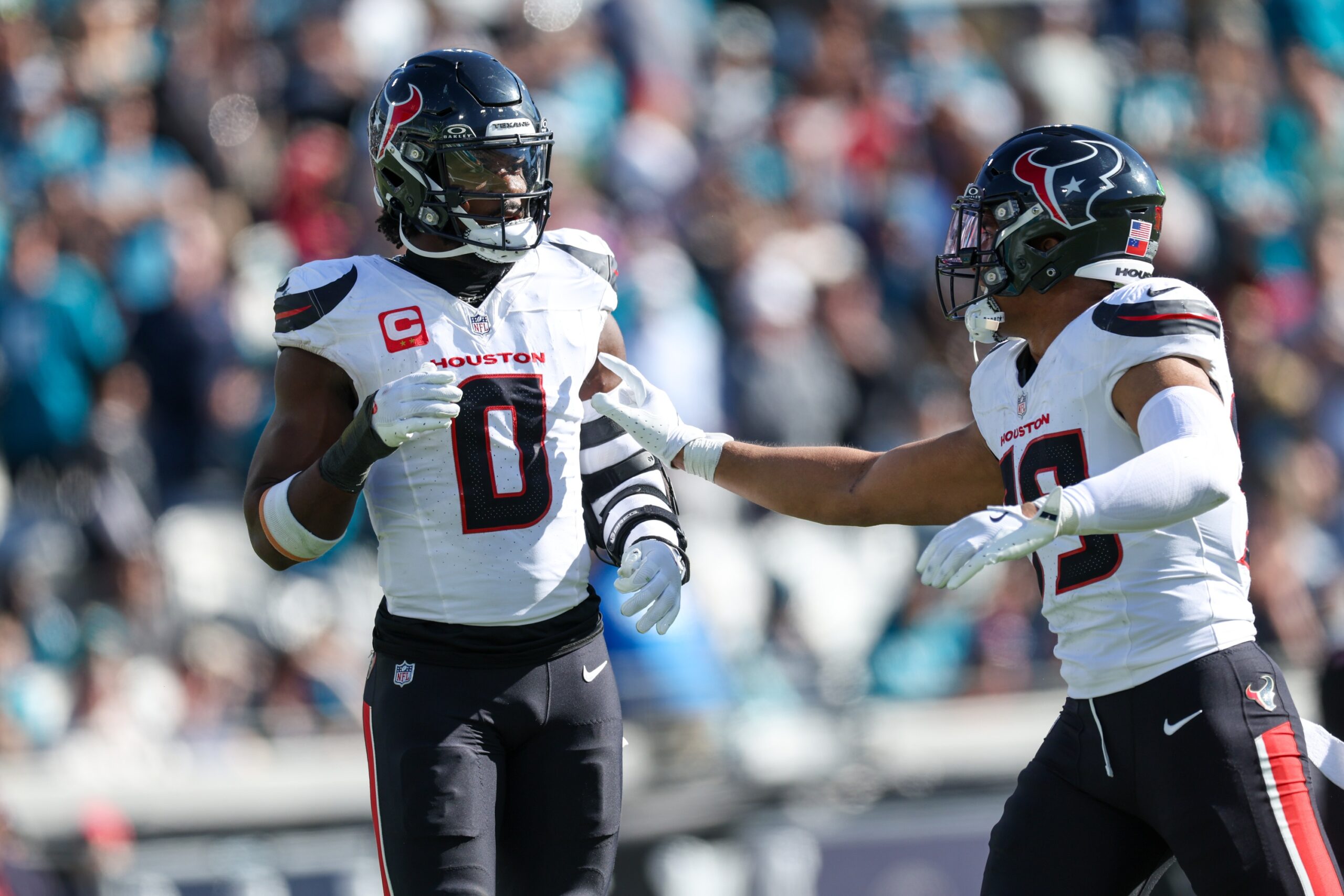 Dec 1, 2024; Jacksonville, Florida, USA; Houston Texans linebacker Azeez Al-Shaair (0) reacts after being ejected against the Jacksonville Jaguars in the second quarter at EverBank Stadium. Mandatory Credit: Nathan Ray Seebeck-Imagn Images