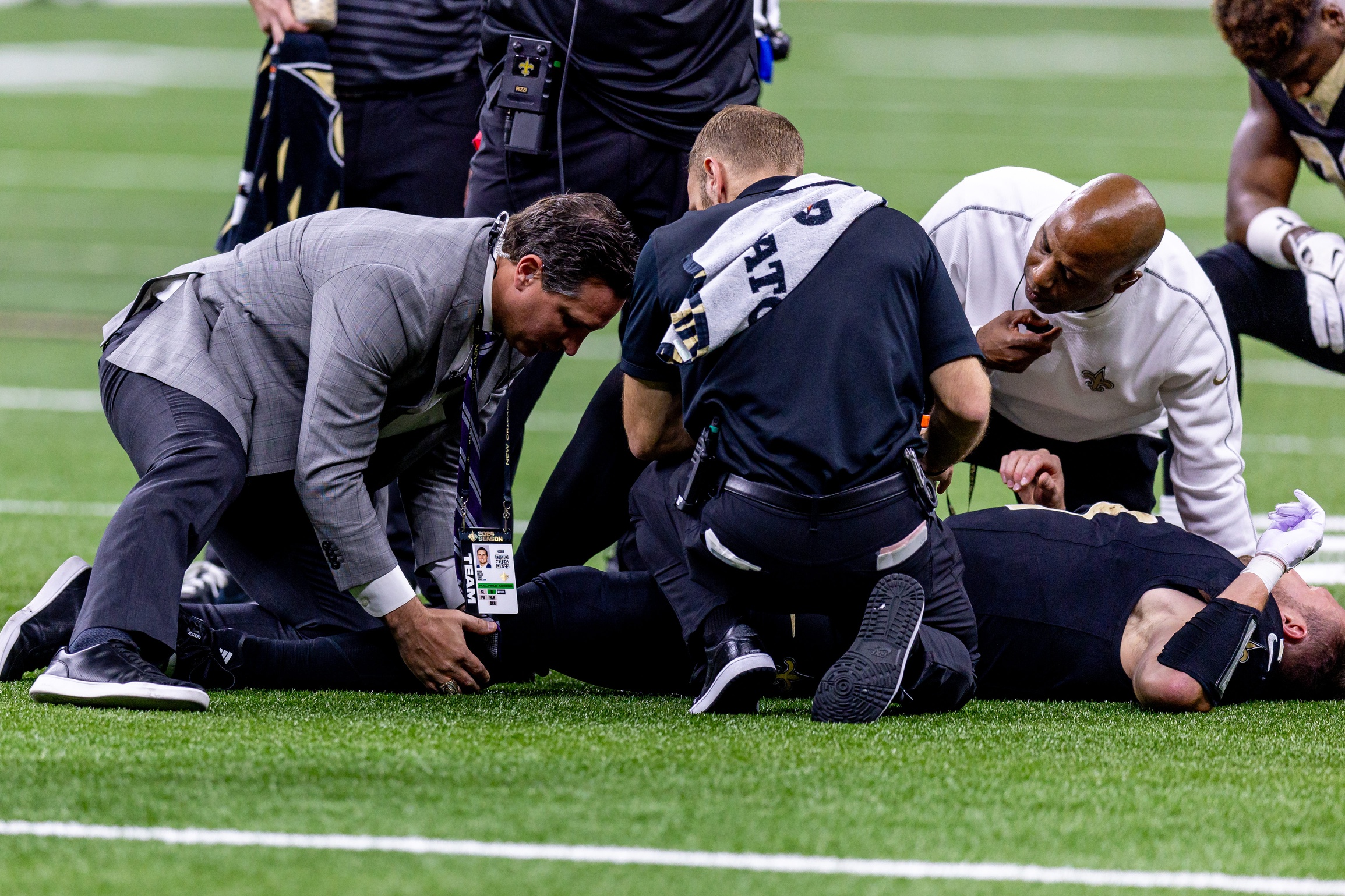 Dec 1, 2024; New Orleans, Louisiana, USA; New Orleans Saints tight end Taysom Hill (7) is injured after a tackle by Los Angeles Rams cornerback Cobie Durant (14) and has to be carted off the field during the second half at Caesars Superdome. Mandatory Credit: Stephen Lew-Imagn Images