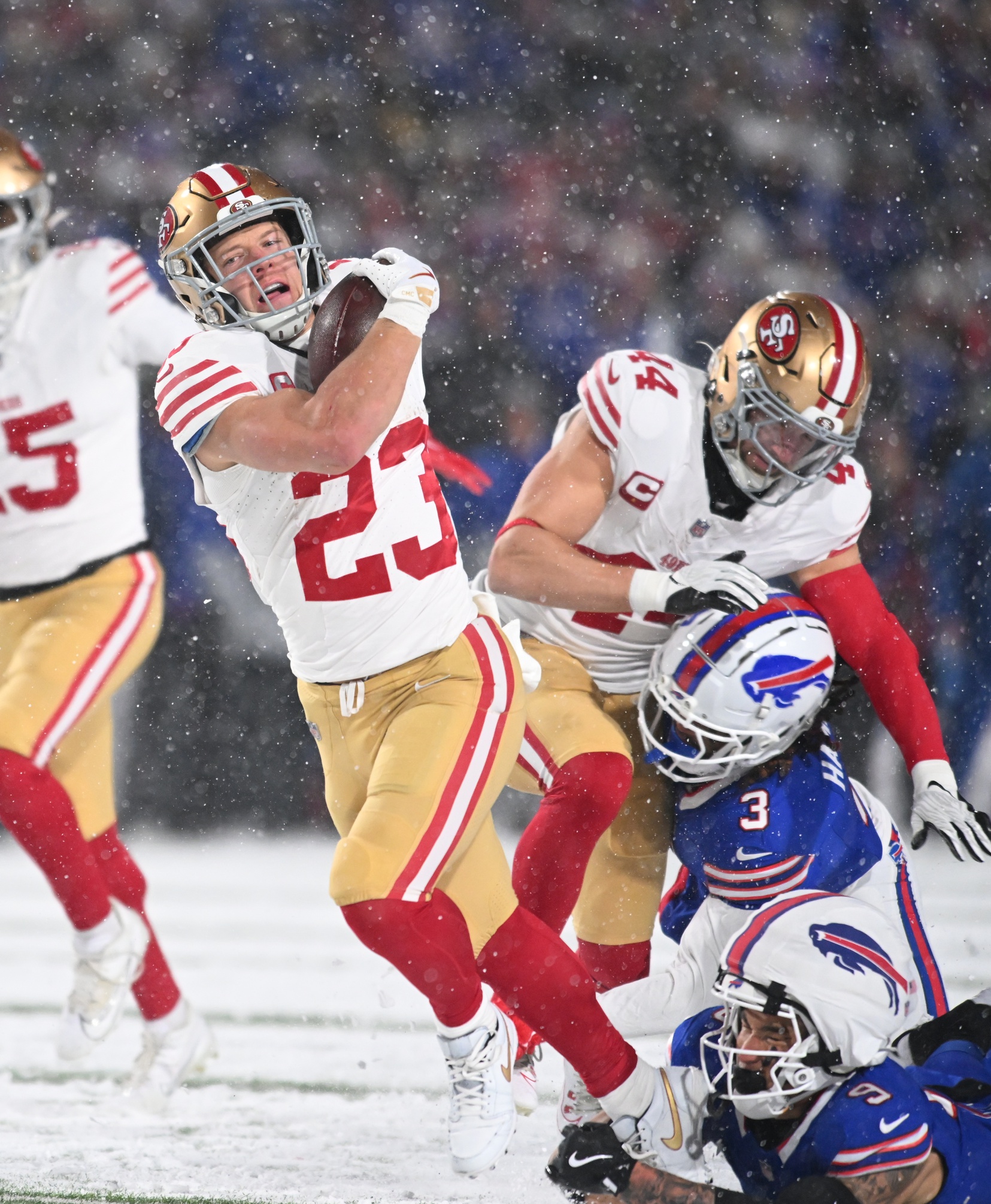 Dec 1, 2024; Orchard Park, New York, USA; San Francisco 49ers running back Christian McCaffrey (23) is tackled by Buffalo Bills safety Taylor Rapp (9) in the second quarter at Highmark Stadium. Mandatory Credit: Mark Konezny-Imagn Images