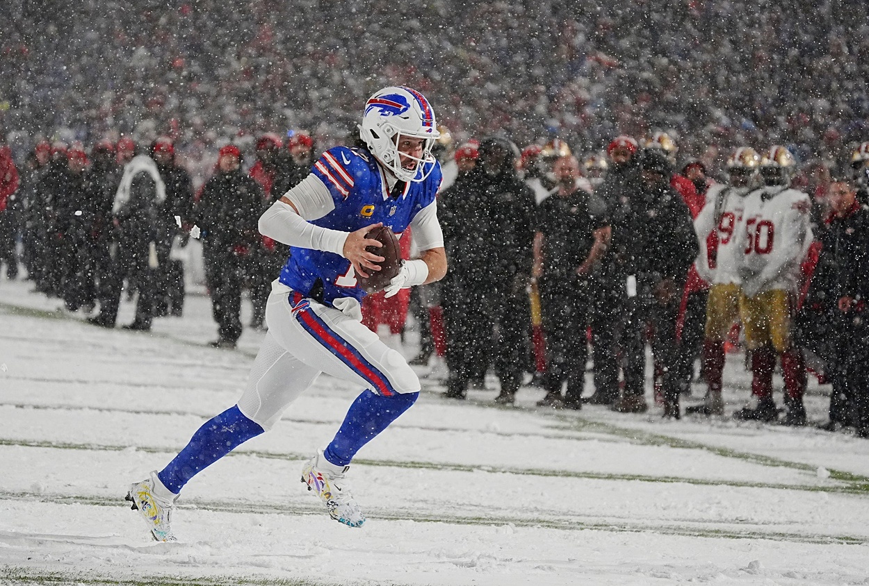 Bills quarterback Josh Allen runs towards the end zone after getting the ball back from Amari Cooper during second half action of their home game against the San Francisco 49ers in Orchard Park on Dec. 1, 2024. © Tina MacIntyre-Yee/Democrat and Chronicle / USA TODAY NETWORK via Imagn Images