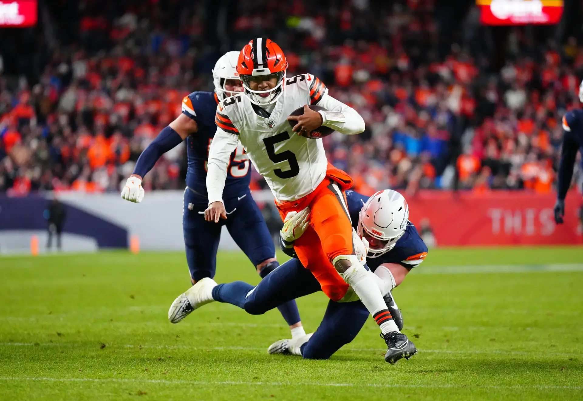 Dec 2, 2024; Denver, Colorado, USA; Denver Broncos defensive end Zach Allen (99) tackles Cleveland Browns quarterback Jameis Winston (5) in the second half at Empower Field at Mile High. Mandatory Credit: Ron Chenoy-Imagn Images