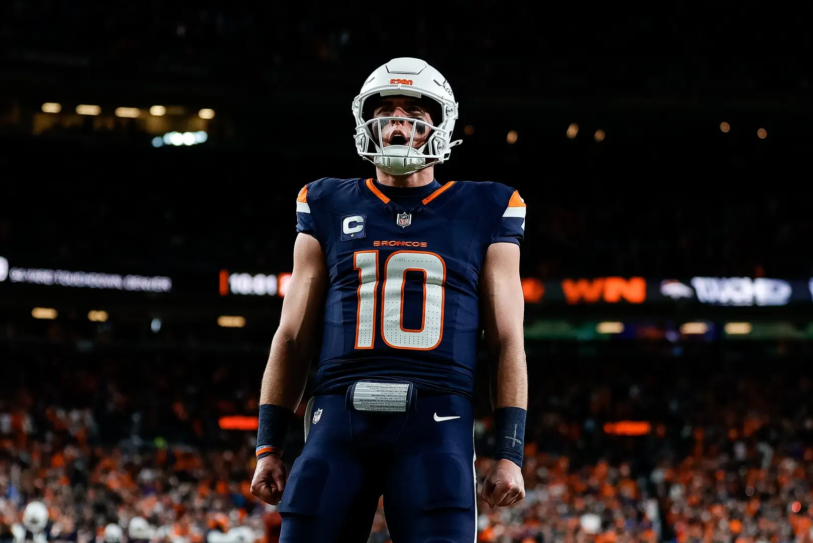 Dec 2, 2024; Denver, Colorado, USA; Denver Broncos quarterback Bo Nix (10) reacts after a play in the third quarter against the Cleveland Browns at Empower Field at Mile High. Mandatory Credit: Isaiah J. Downing-Imagn Images