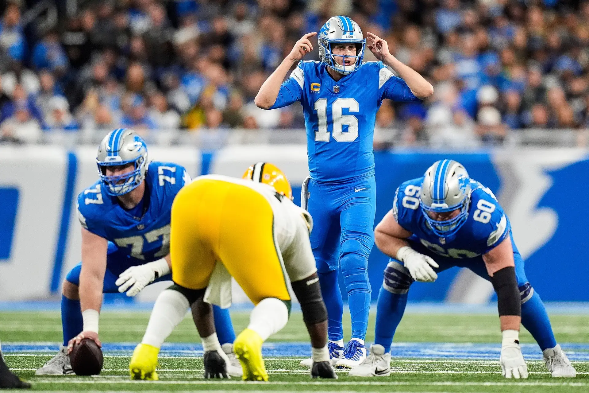 Detroit Lions quarterback Jared Goff (16) talks to teammates before a snap against Green Bay Packers during the first half at Ford Field in Detroit on Thursday, Dec. 5, 2024. © Junfu Han / USA TODAY NETWORK via Imagn Images