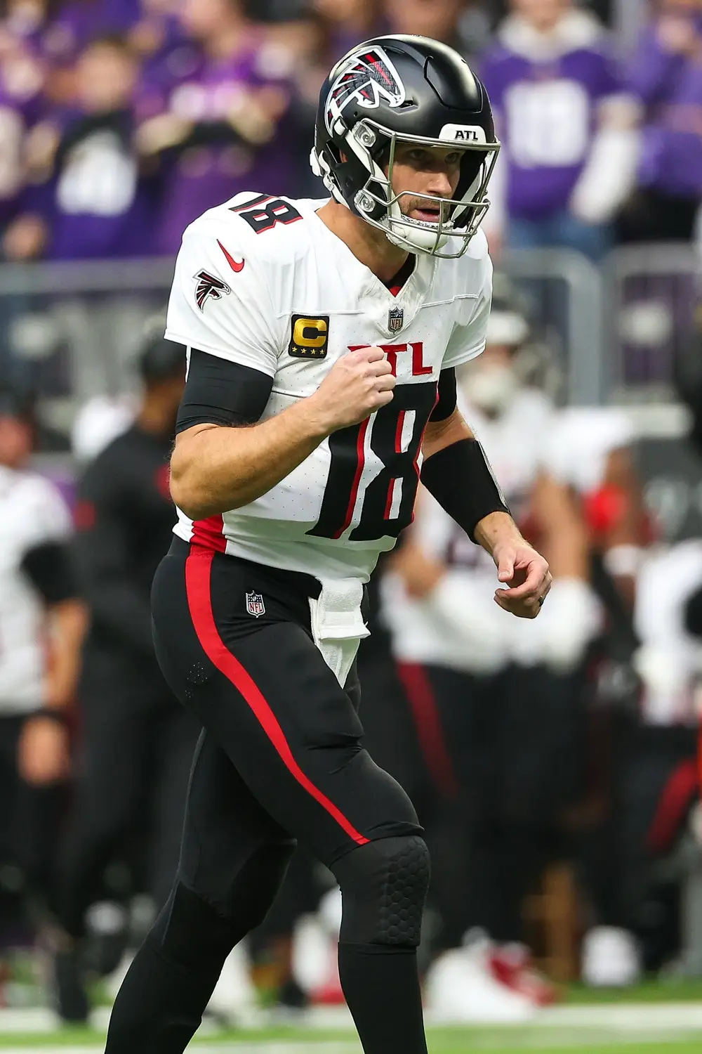 Dec 8, 2024; Minneapolis, Minnesota, USA; Atlanta Falcons quarterback Kirk Cousins (18) celebrates running back Tyler Allgeier's (25) touchdown against the Minnesota Vikings during the first quarter at U.S. Bank Stadium. Mandatory Credit: Matt Krohn-Imagn Images