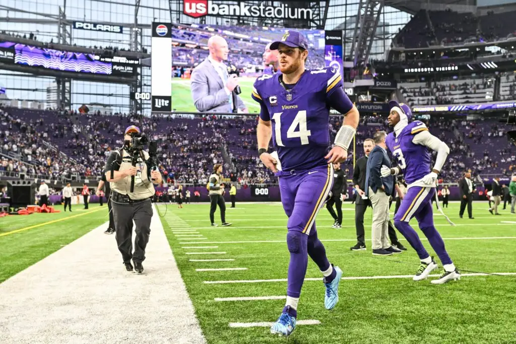 Dec 8, 2024; Minneapolis, Minnesota, USA; Minnesota Vikings quarterback Sam Darnold (14) runs off the field after the game against the Atlanta Falcons at U.S. Bank Stadium. Mandatory Credit: Jeffrey Becker-Imagn Images