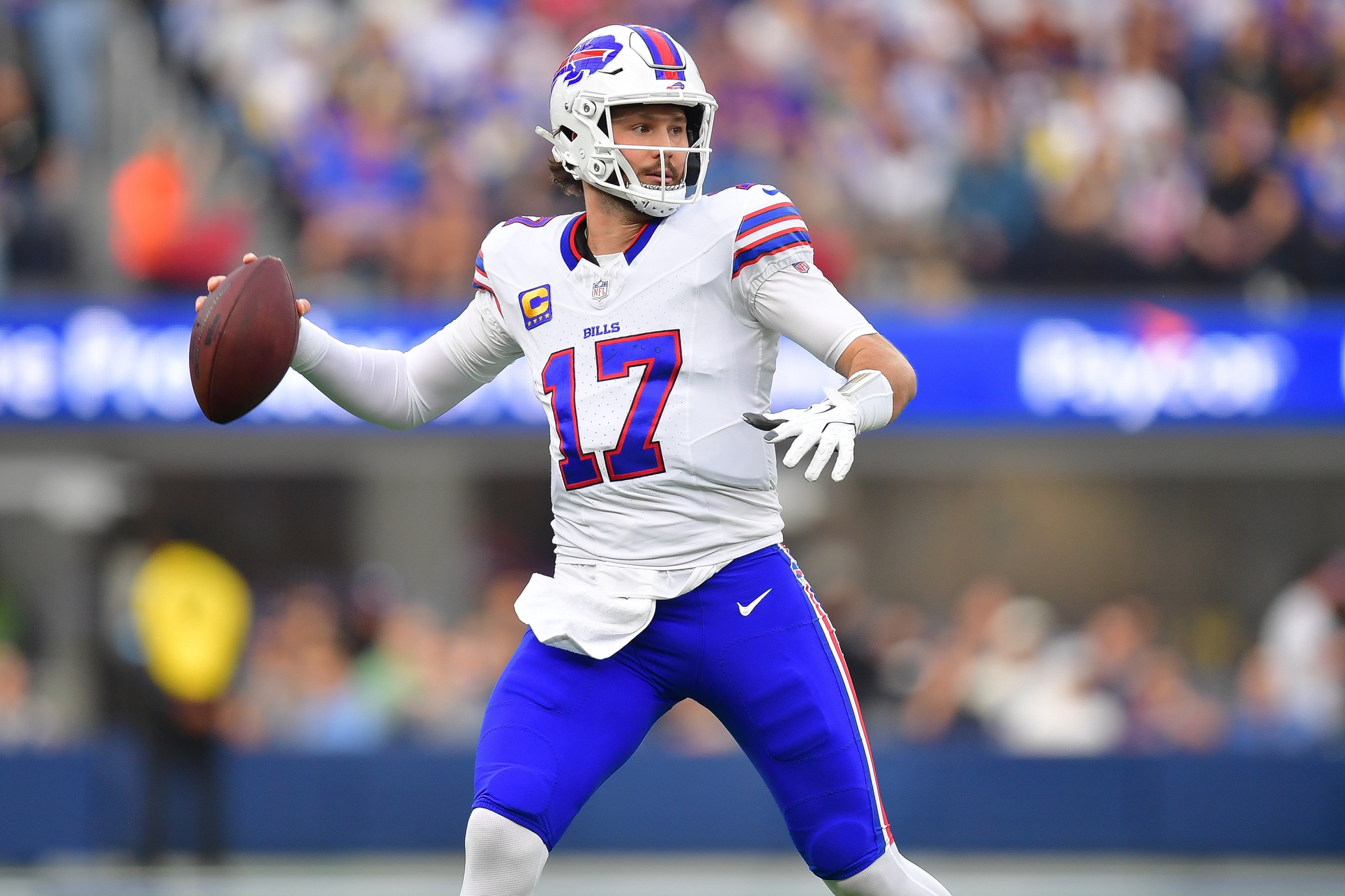 Dec 8, 2024; Inglewood, California, USA; Buffalo Bills quarterback Josh Allen (17) throws against the Los Angeles Rams during the first half at SoFi Stadium. Mandatory Credit: Gary A. Vasquez-Imagn Images