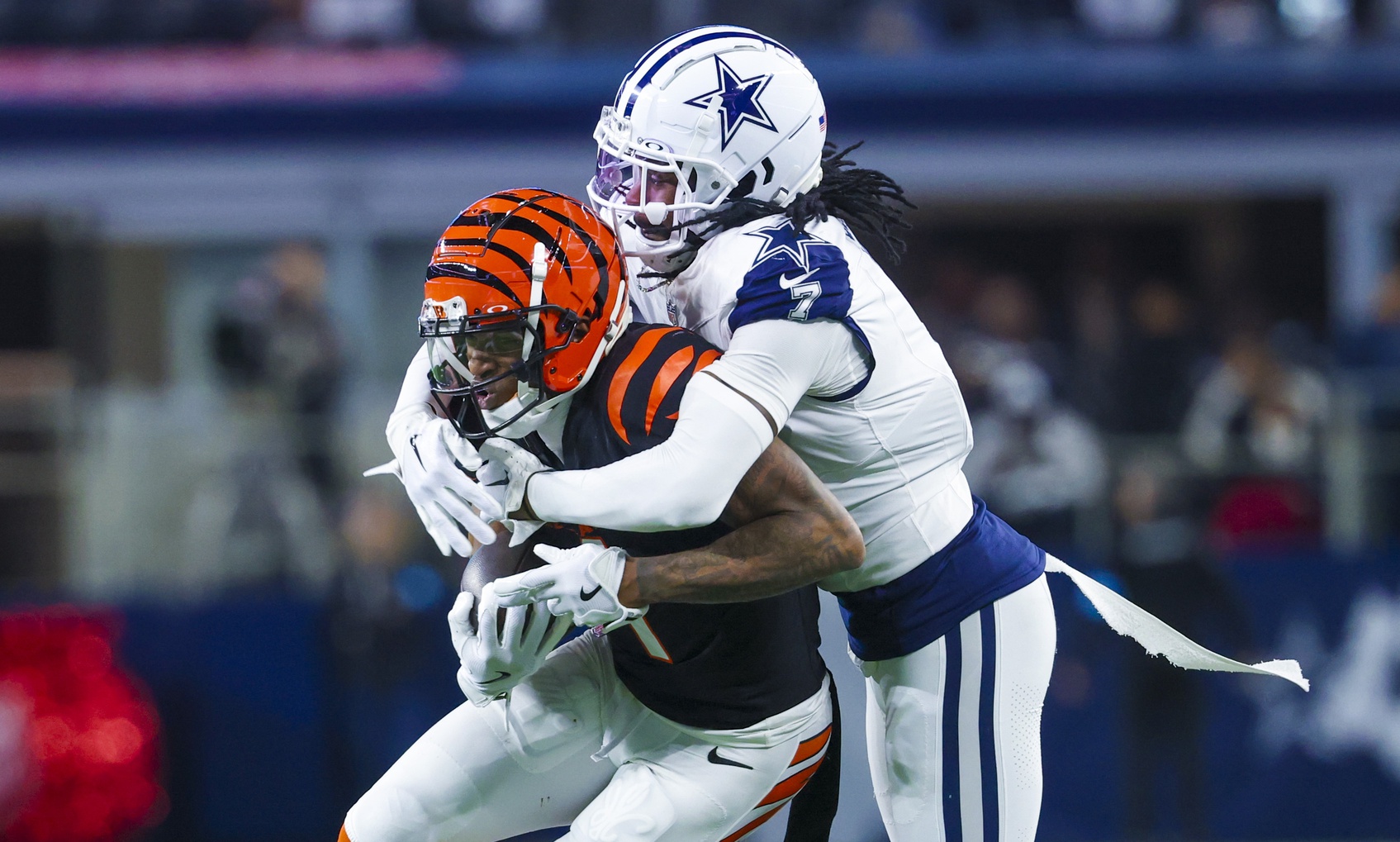 Dec 9, 2024; Arlington, Texas, USA; Dallas Cowboys cornerback Trevon Diggs (7) tackles Cincinnati Bengals wide receiver Ja'Marr Chase (1) during the first half at AT&T Stadium. Mandatory Credit: Kevin Jairaj-Imagn Images