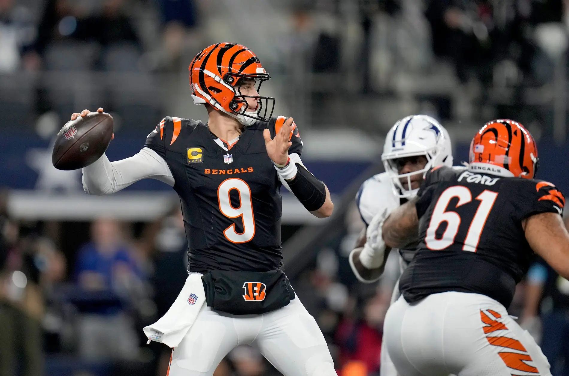 Cincinnati Bengals quarterback Joe Burrow (9) looks to make a pass during the 2nd quarter during Monday Night Football at AT&T Stadium in Arlington,Texas on Monday, December 9, 2024.