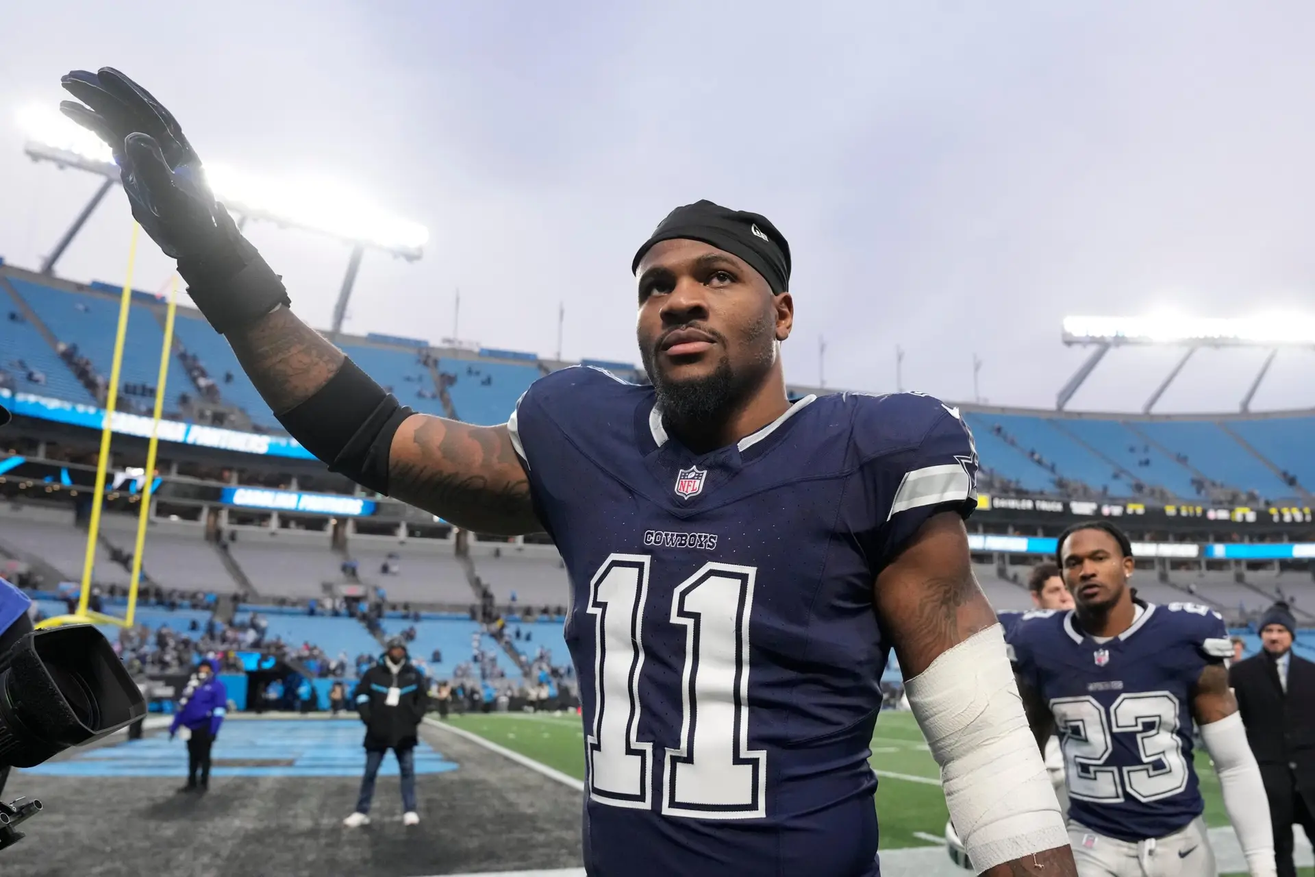 Dec 15, 2024; Charlotte, North Carolina, USA; Dallas Cowboys linebacker Micah Parsons (11) walks off the field after the game at Bank of America Stadium. Mandatory Credit: Bob Donnan-Imagn Images