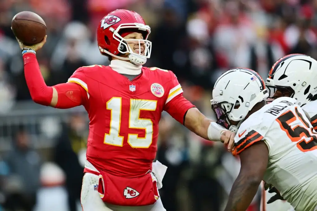 Dec 15, 2024; Cleveland, Ohio, USA; Cleveland Browns defensive tackle Mike Hall Jr. (51) and linebacker Devin Bush (30) rush Kansas City Chiefs quarterback Patrick Mahomes (15) during the second half at Huntington Bank Field. Mandatory Credit: Ken Blaze-Imagn Images