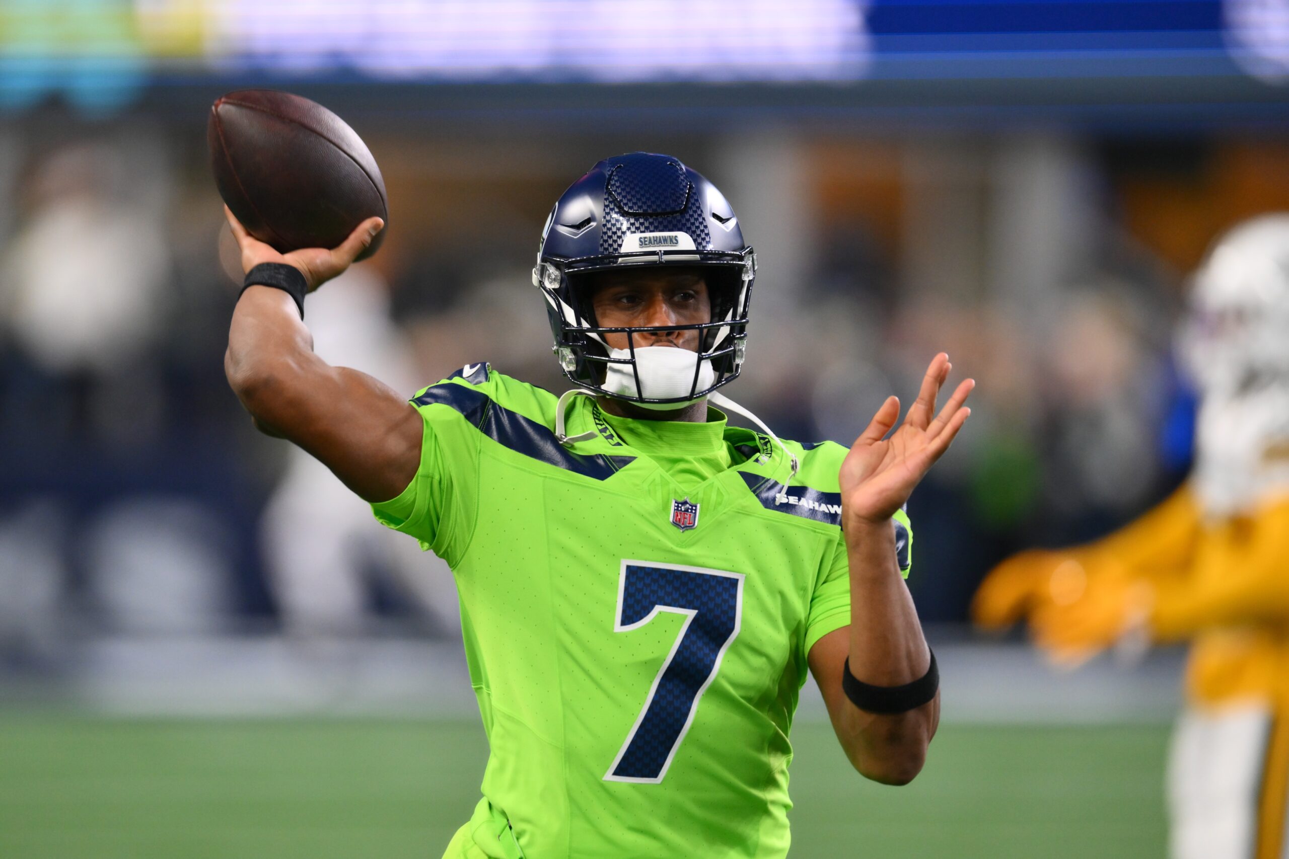 Dec 15, 2024; Seattle, Washington, USA; Seattle Seahawks quarterback Geno Smith (7) throws the ball during warmups before the game against the Green Bay Packers at Lumen Field. Mandatory Credit: Steven Bisig-Imagn Images