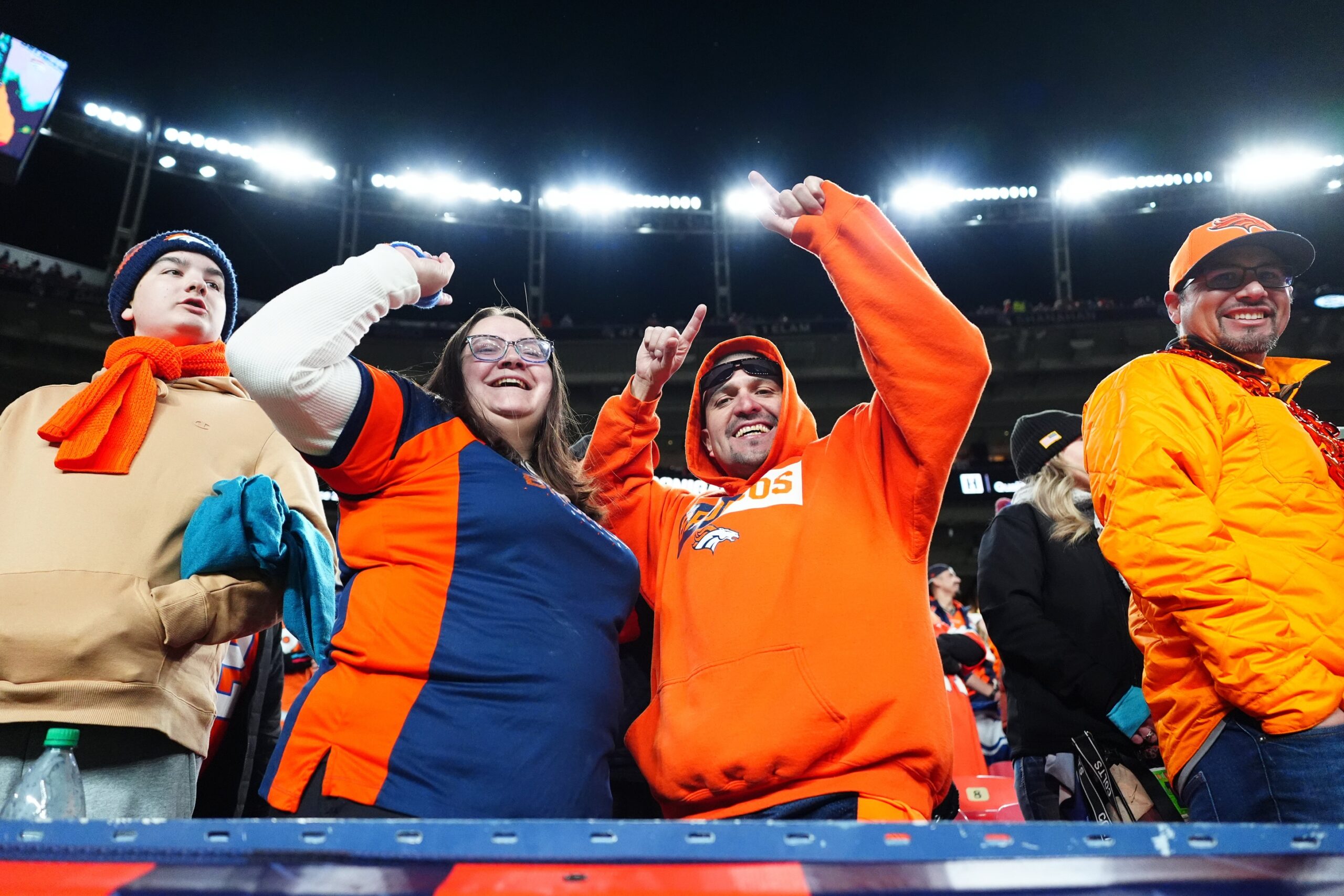 Dec 15, 2024; Denver, Colorado, USA; Denver Broncos fans cheer following the game against the Indianapolis Colts at Empower Field at Mile High. Mandatory Credit: Ron Chenoy-Imagn Images