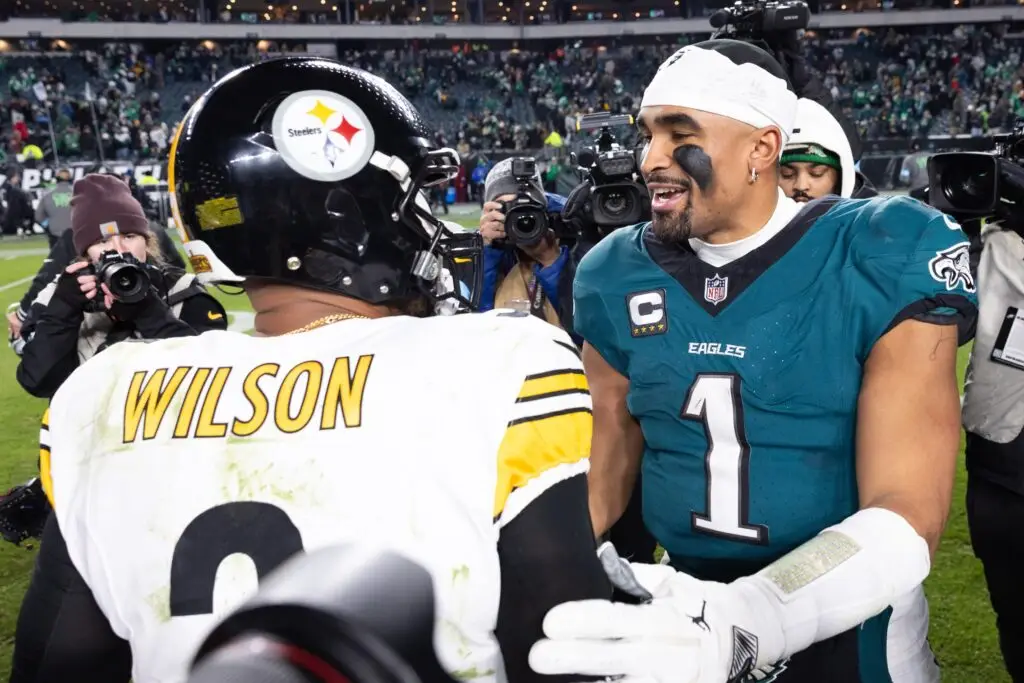 Dec 15, 2024; Philadelphia, Pennsylvania, USA; Philadelphia Eagles quarterback Jalen Hurts (1) and Pittsburgh Steelers quarterback Russell Wilson (3) shake hands after the game at Lincoln Financial Field. Mandatory Credit: Bill Streicher-Imagn Images