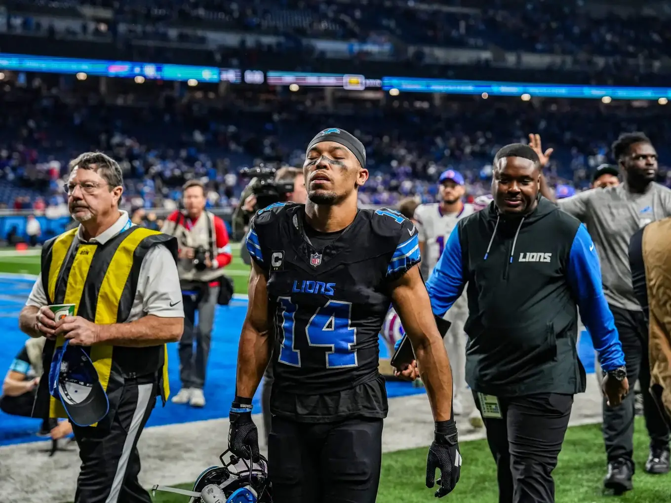 Detroit Lions wide receiver Amon-Ra St. Brown (14) walks off the field after losing to the Buffalo Bills 48-42, during the second half at Ford Field in Detroit on Sunday, Dec. 15, 2024. © Kimberly P. Mitchell / USA TODAY NETWORK via Imagn Images