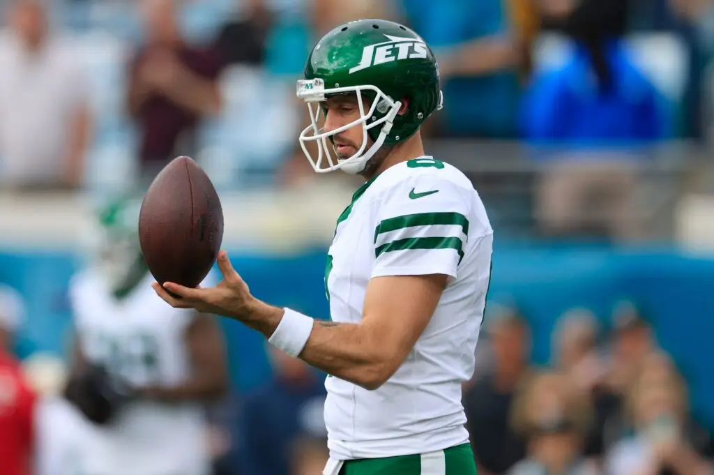 New York Jets quarterback Aaron Rodgers (8) balances a ball before an NFL football matchup Sunday, Dec. 15, 2024 at EverBank Stadium in Jacksonville, Fla. [Corey Perrine/Florida Times-Union]