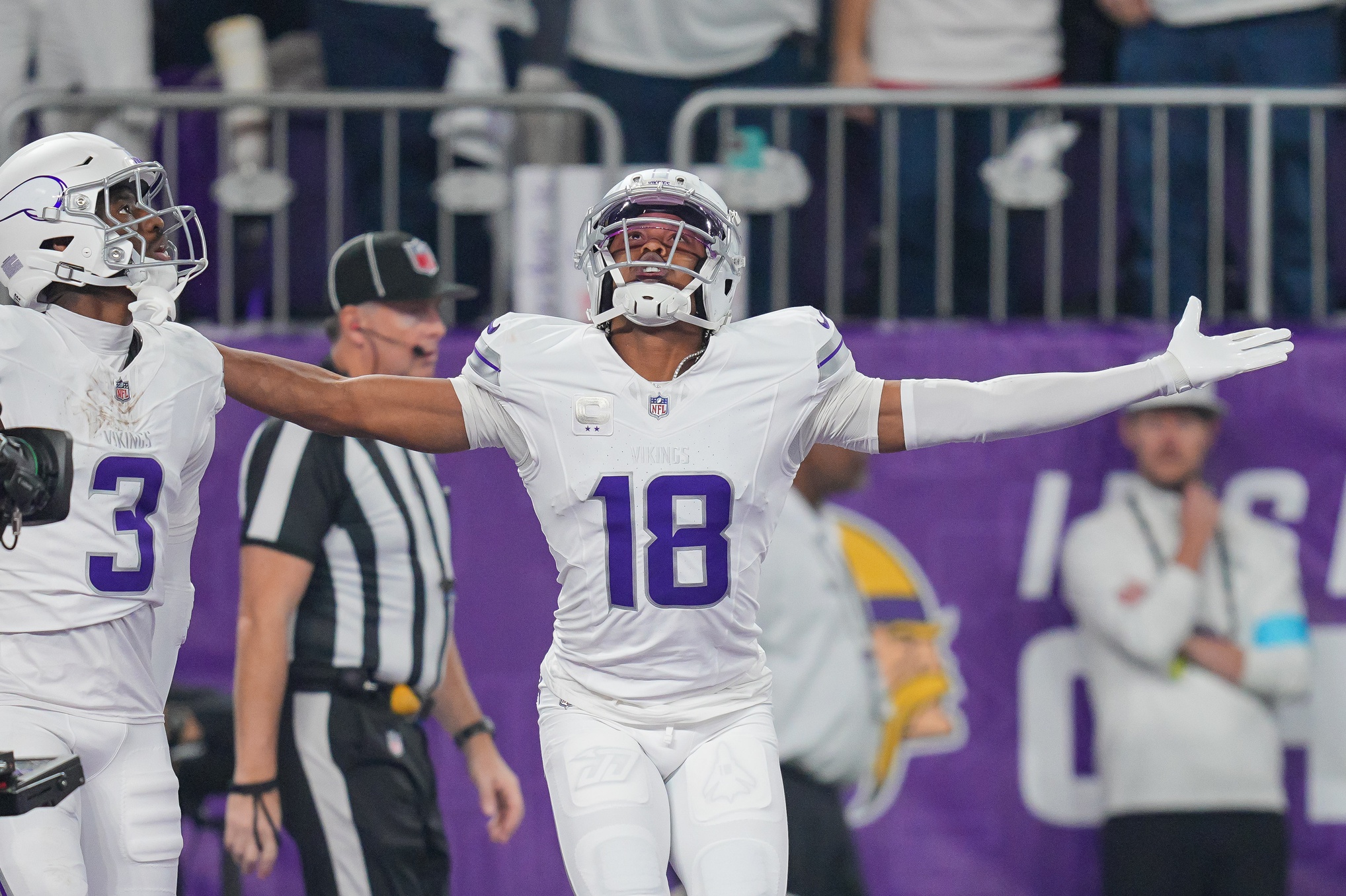 Dec 16, 2024; Minneapolis, Minnesota, USA; Minnesota Vikings wide receiver Justin Jefferson (18) celebrates his touchdown against the Chicago Bears in the first quarter at U.S. Bank Stadium. Mandatory Credit: Brad Rempel-Imagn Images