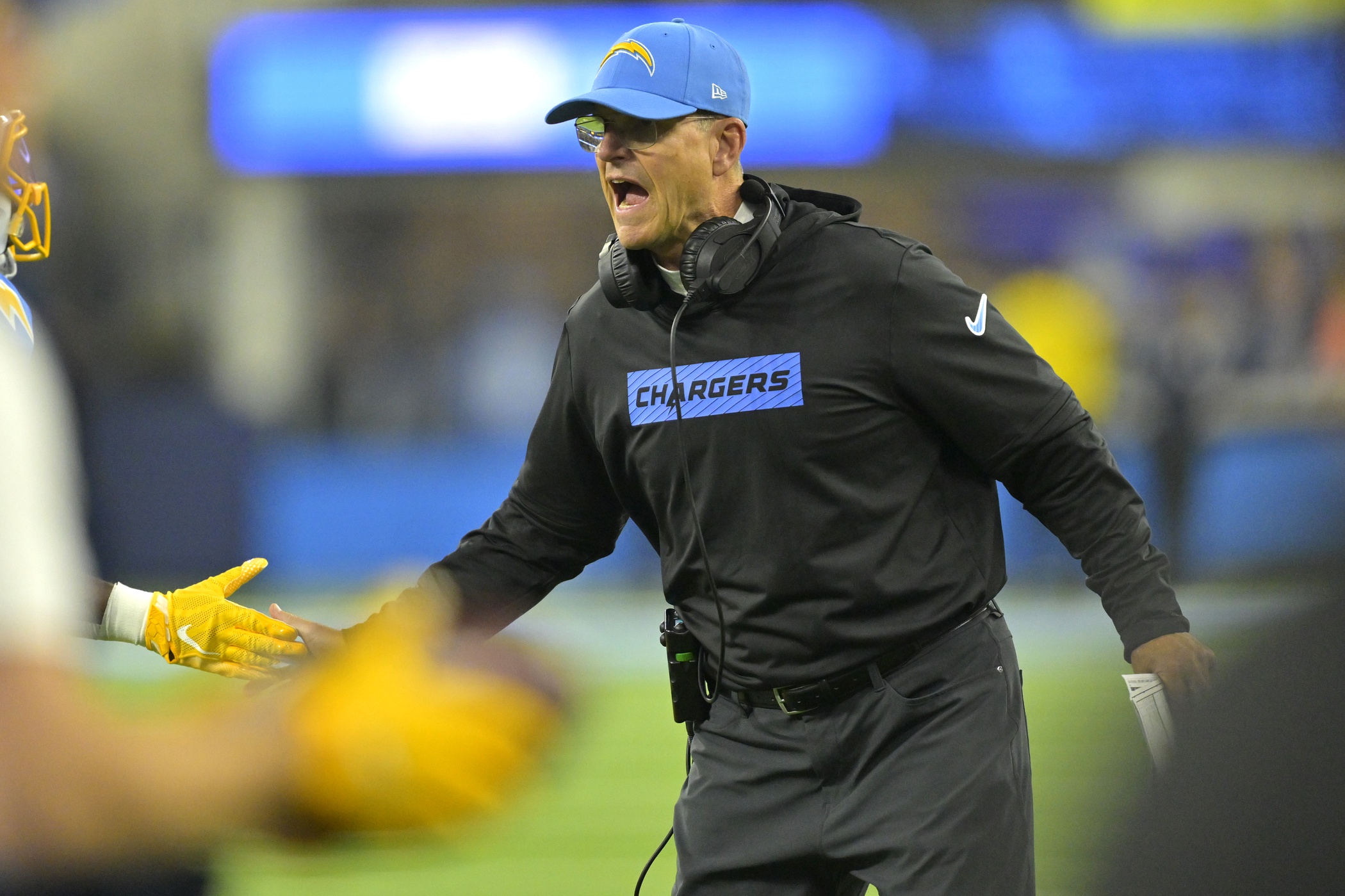 Dec 19, 2024; Inglewood, California, USA; Los Angeles Chargers head coach Jim Harbaugh congratulates players after a score in the second half against the Denver Broncos at SoFi Stadium. Mandatory Credit: Jayne Kamin-Oncea-Imagn Images