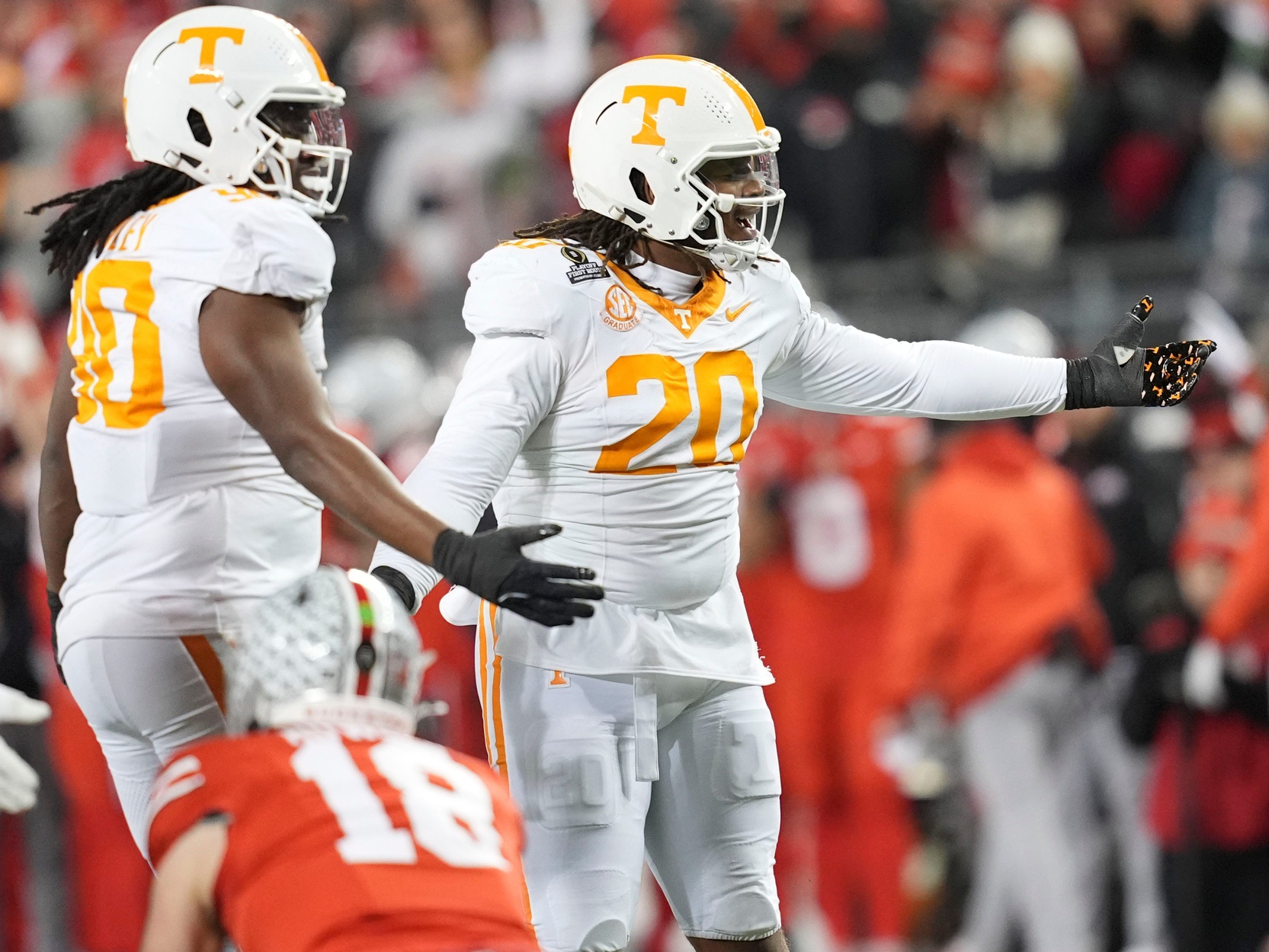 Tennessee defensive linemen Bryson Eason (20) and Dominic Bailey (90) react after Eason was called for a face mask penalty during the NCAA college football playoff game against Ohio State on Saturday, Dec. 21, 2024, in Columbus, Ohio. © Saul Young/News Sentinel / USA TODAY NETWORK via Imagn Images