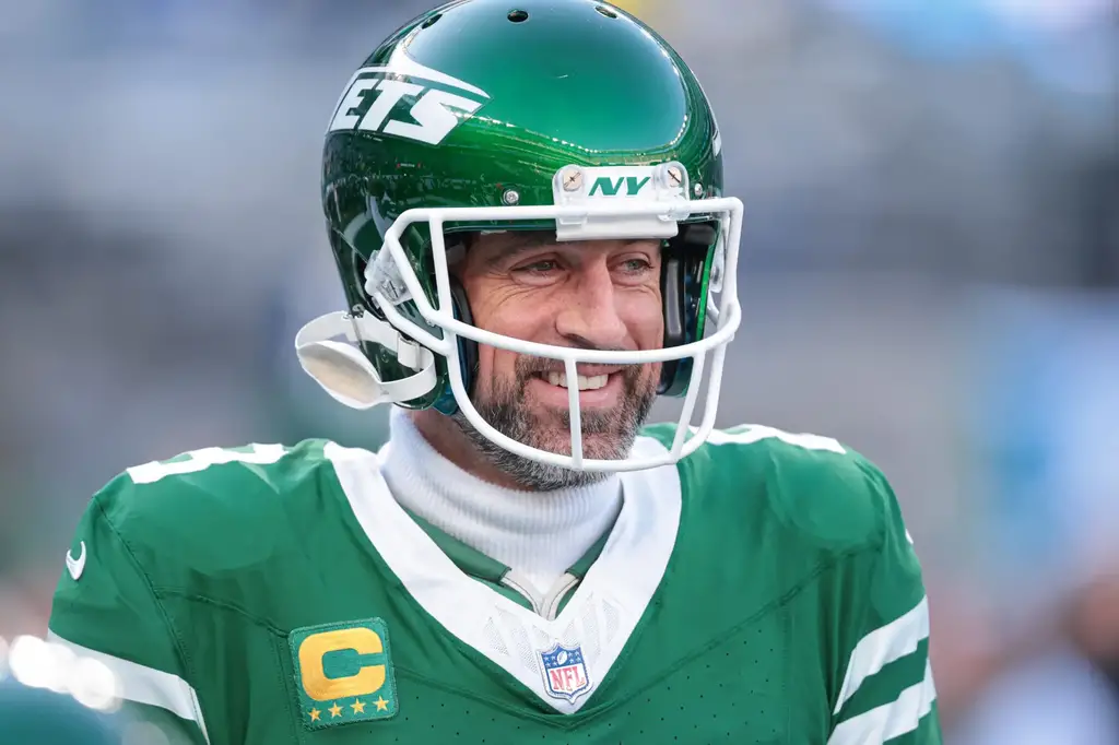 Dec 22, 2024; East Rutherford, New Jersey, USA; New York Jets quarterback Aaron Rodgers (8) looks on before the game against the Los Angeles Rams at MetLife Stadium. Mandatory Credit: Vincent Carchietta-Imagn Images