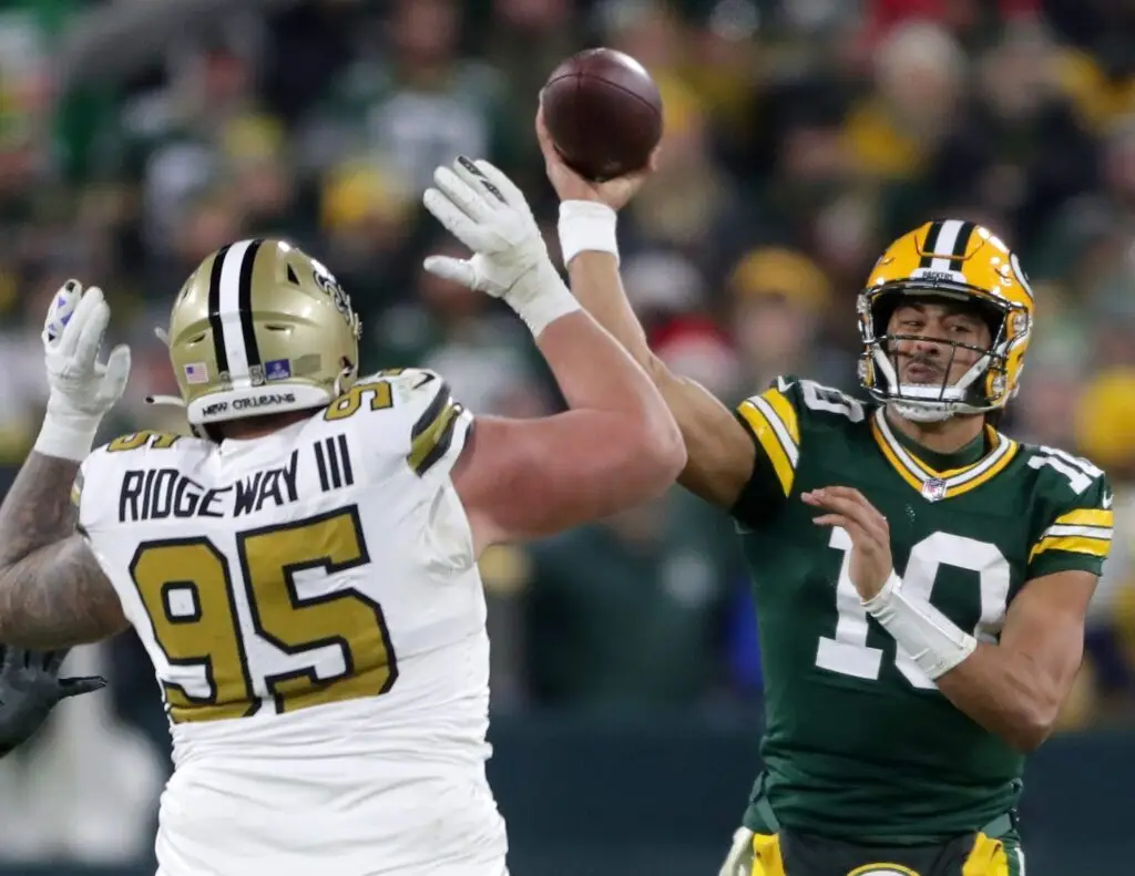 Green Bay Packers quarterback Jordan Love (10) throws under pressure from New Orleans Saints defensive tackle John Ridgeway III (95) on Monday, December 23, 2024 at Lambeau Field in Green Bay, Wis. The Packers defeated the Saints 34-0. Wm. Glasheen USA TODAY NETWORK-Wisconsin