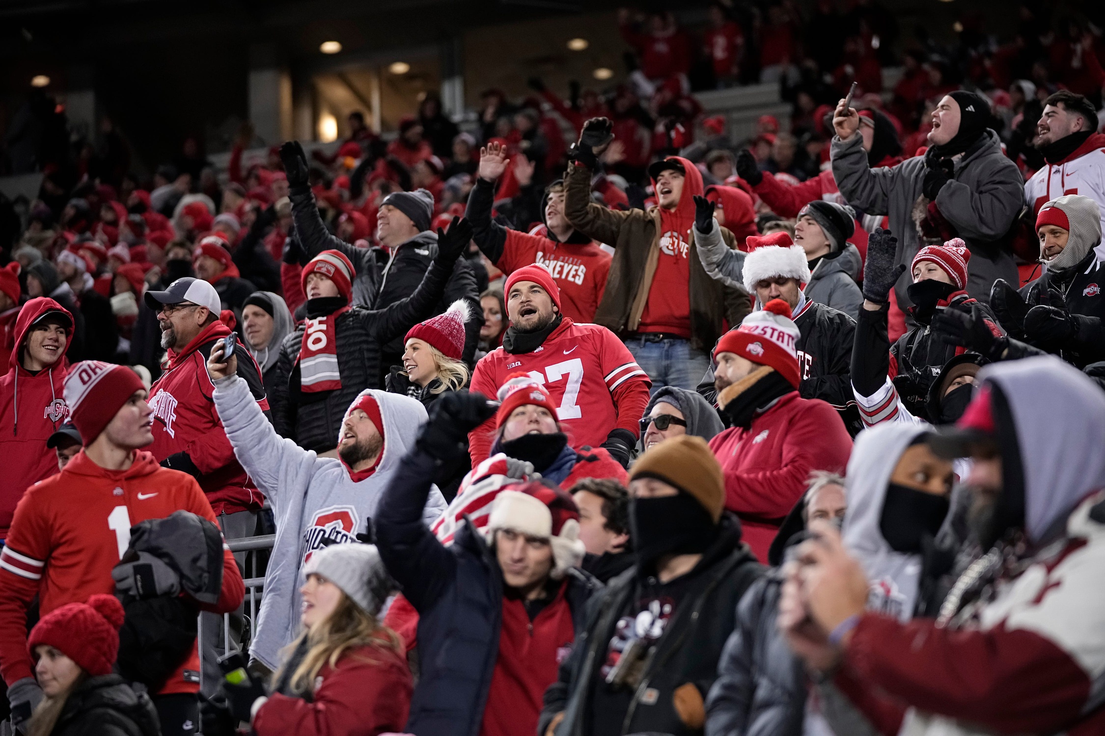 Ohio State Buckeyes fans cheer during the second half of the College Football Playoff first round game against the Tennessee Volunteers at Ohio Stadium in Columbus on Dec. 22, 2024. Ohio State won 42-17. © Adam Cairns/Columbus Dispatch / USA TODAY NETWORK via Imagn Images