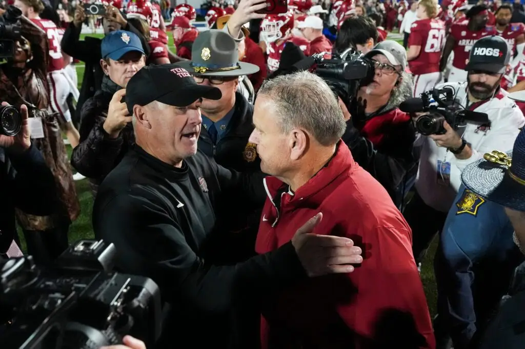 'Fracturing': College Football Coach Dan Lanning 'Snitched' On Tennessee QB (Report) 3 Texas Tech's head coach Joey McGuire and Arkansas' head coach Sam Pittman embrace after Arkansas defeated Texas Tech