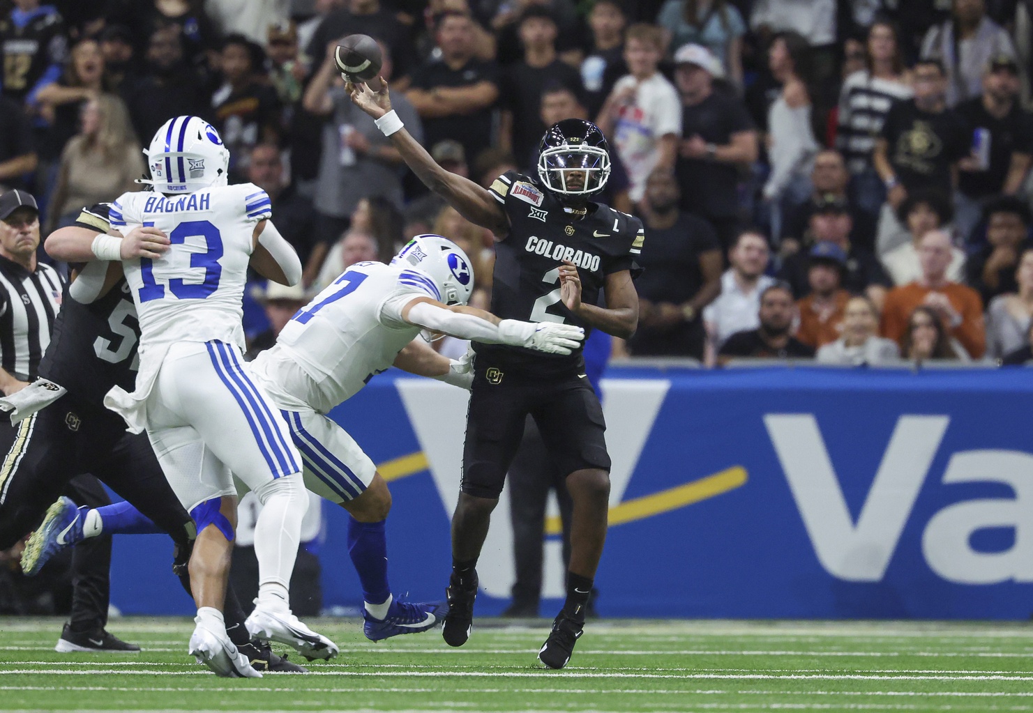 Dec 28, 2024; San Antonio, TX, USA; Colorado Buffaloes quarterback Shedeur Sanders (2) attempts a pass as Brigham Young Cougars linebacker Jack Kelly (17) defends during the second quarter at Alamodome. Mandatory Credit: Troy Taormina-Imagn Images