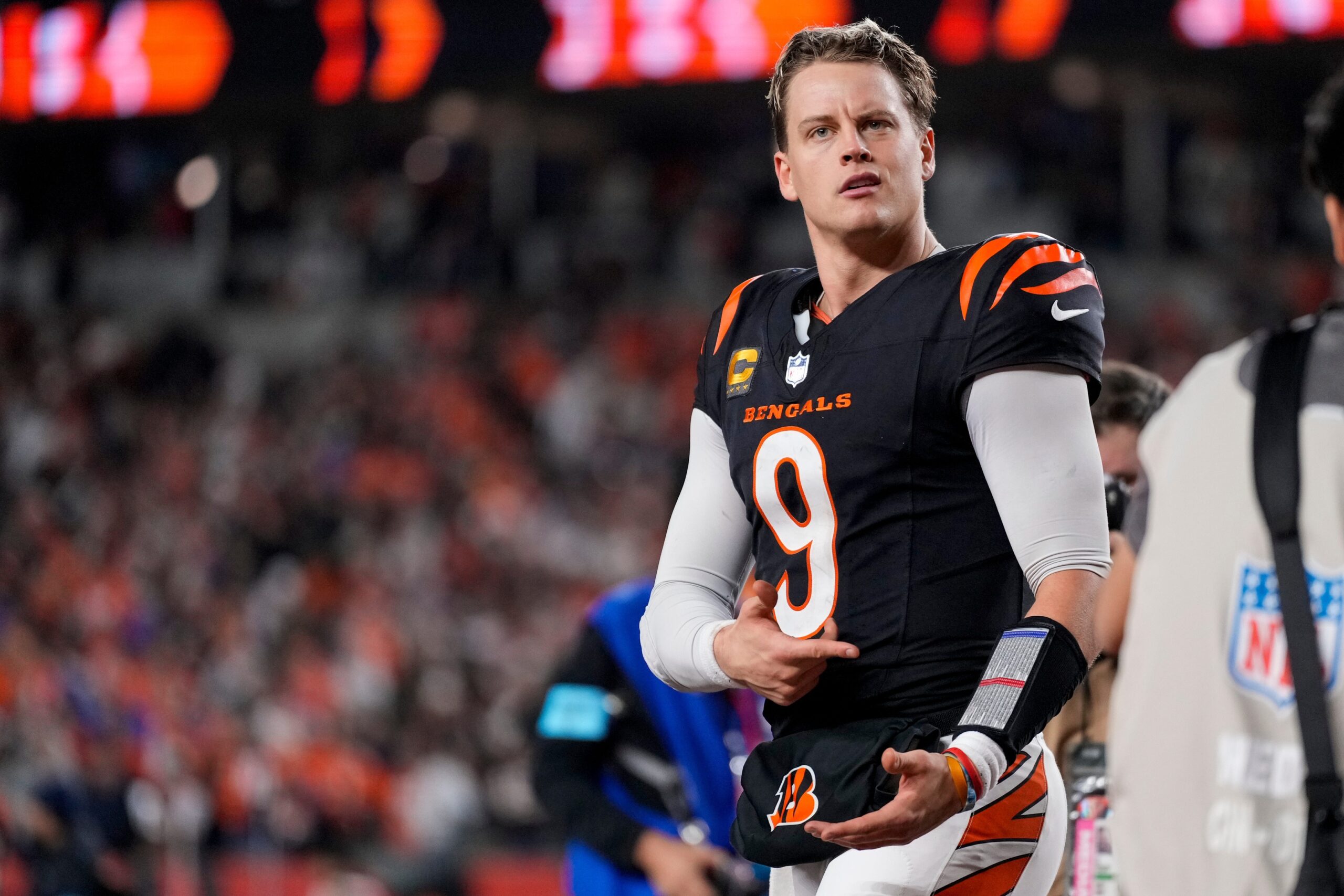 Cincinnati Bengals quarterback Joe Burrow (9) celebrates after the game-winning touchdown pass to Tee Higgins in overtime of the NFL Week 17 game between the Cincinnati Bengals and the Denver Broncos at Paycor Stadium in downtown Cincinnati on Saturday, Dec. 28, 2024. The Bengals took a 30-24 win in overtime to remain in the post season chase. © Sam Greene/The Enquirer / USA TODAY NETWORK via Imagn Images