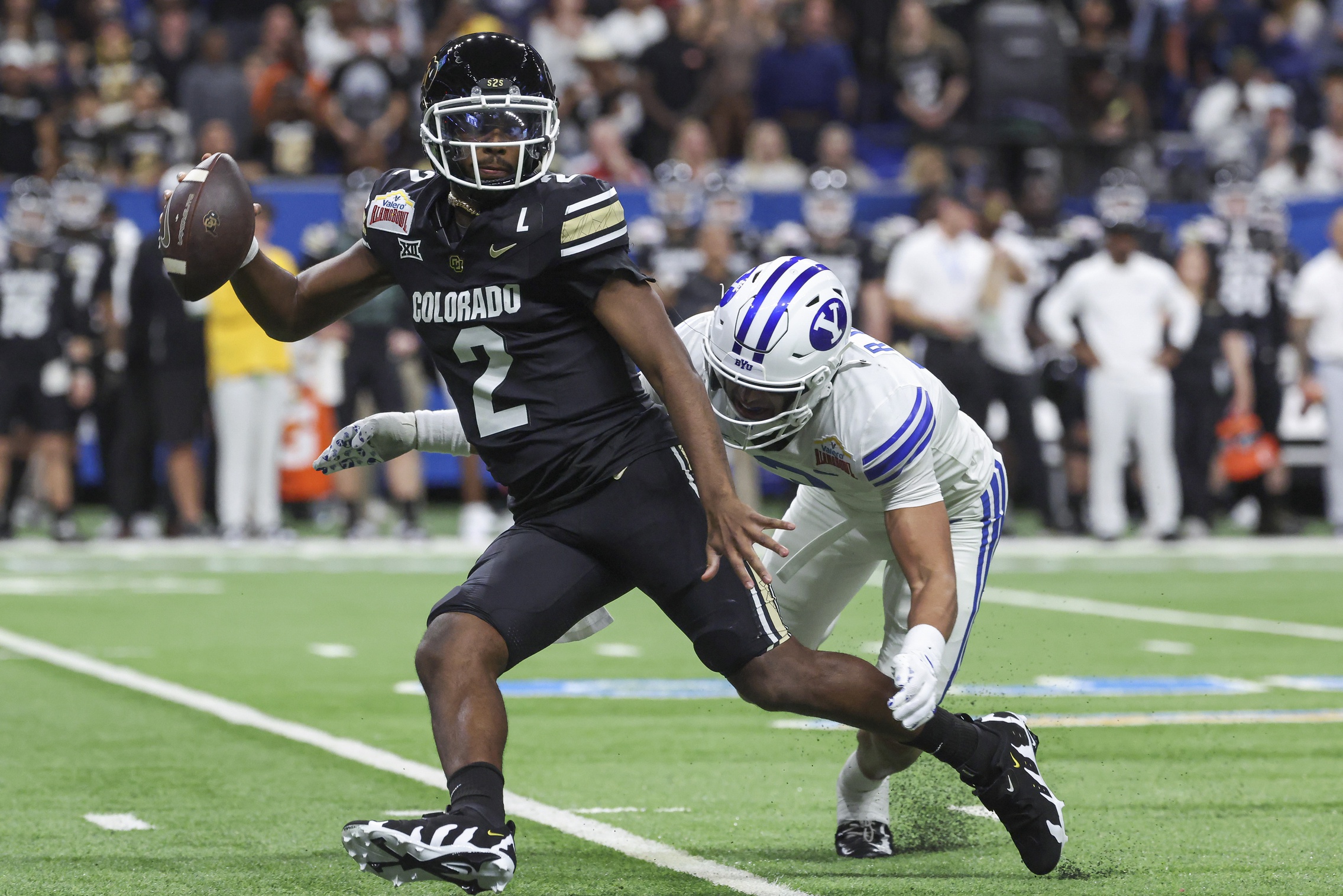 Breaking: NFL Hands Out Quarter Million Dollar Fine In Shedeur Sanders Prank Call Incident 4 Dec 28, 2024; San Antonio, TX, USA; Colorado Buffaloes quarterback Shedeur Sanders (2) attempts to avoid a tackle by Brigham Young Cougars safety Raider Damuni (3) during the second quarter at Alamodome. Mandatory Credit: Troy Taormina-Imagn Images