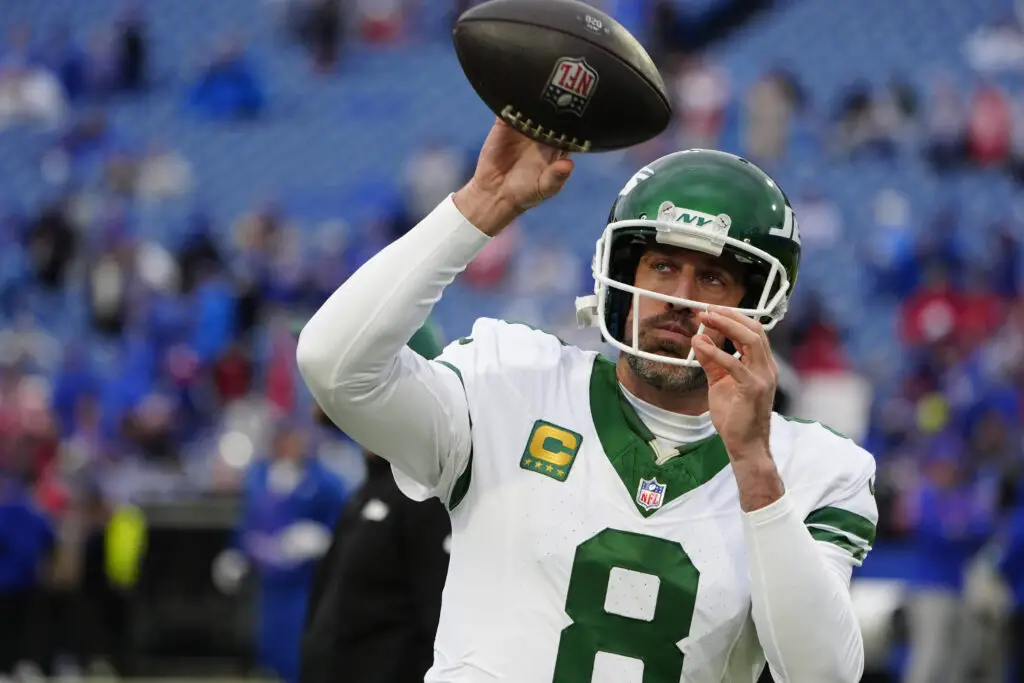 Dec 29, 2024; Orchard Park, New York, USA; New York Jets quarterback Aaron Rodgers (8) warms up prior to the game against the Buffalo Bills at Highmark Stadium. Mandatory Credit: Gregory Fisher-Imagn Images