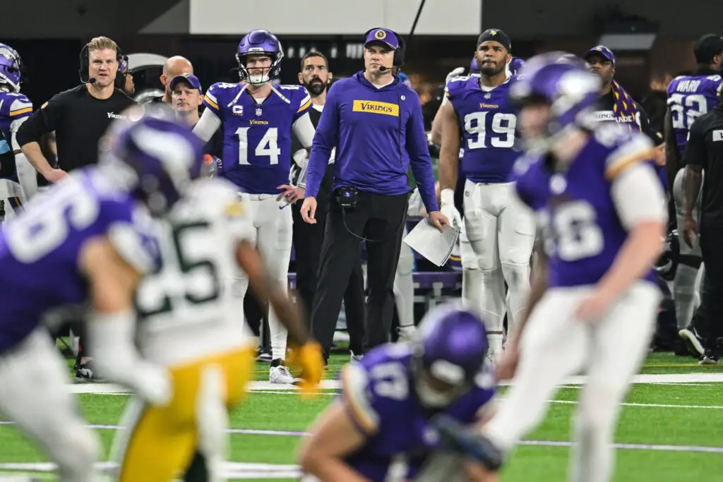 Dec 29, 2024; Minneapolis, Minnesota, USA; Minnesota Vikings head coach Kevin O’Connell and quarterback Sam Darnold (14) and defensive tackle Jerry Tillery (99) look on during a field goal attempt against the Green Bay Packers during the second quarter at U.S. Bank Stadium. Mandatory Credit: Jeffrey Becker-Imagn Images