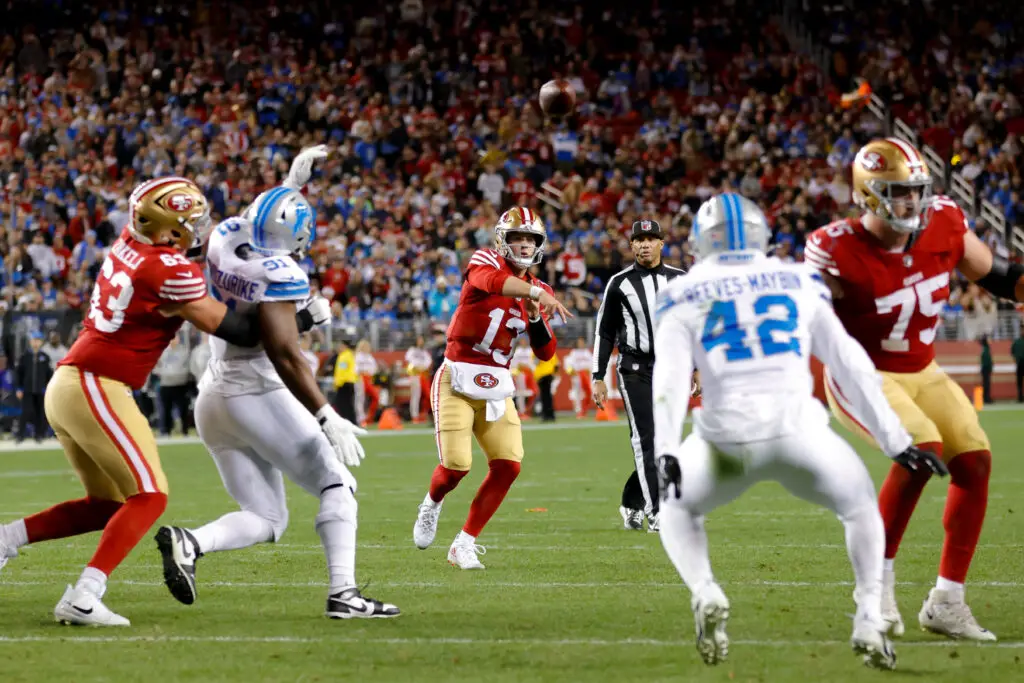 Dec 30, 2024; Santa Clara, California, USA; San Francisco 49ers quarterback Brock Purdy (13) throws a touchdown pass during the first quarter against the Detroit Lions at Levi's Stadium. Mandatory Credit: Sergio Estrada-Imagn Images