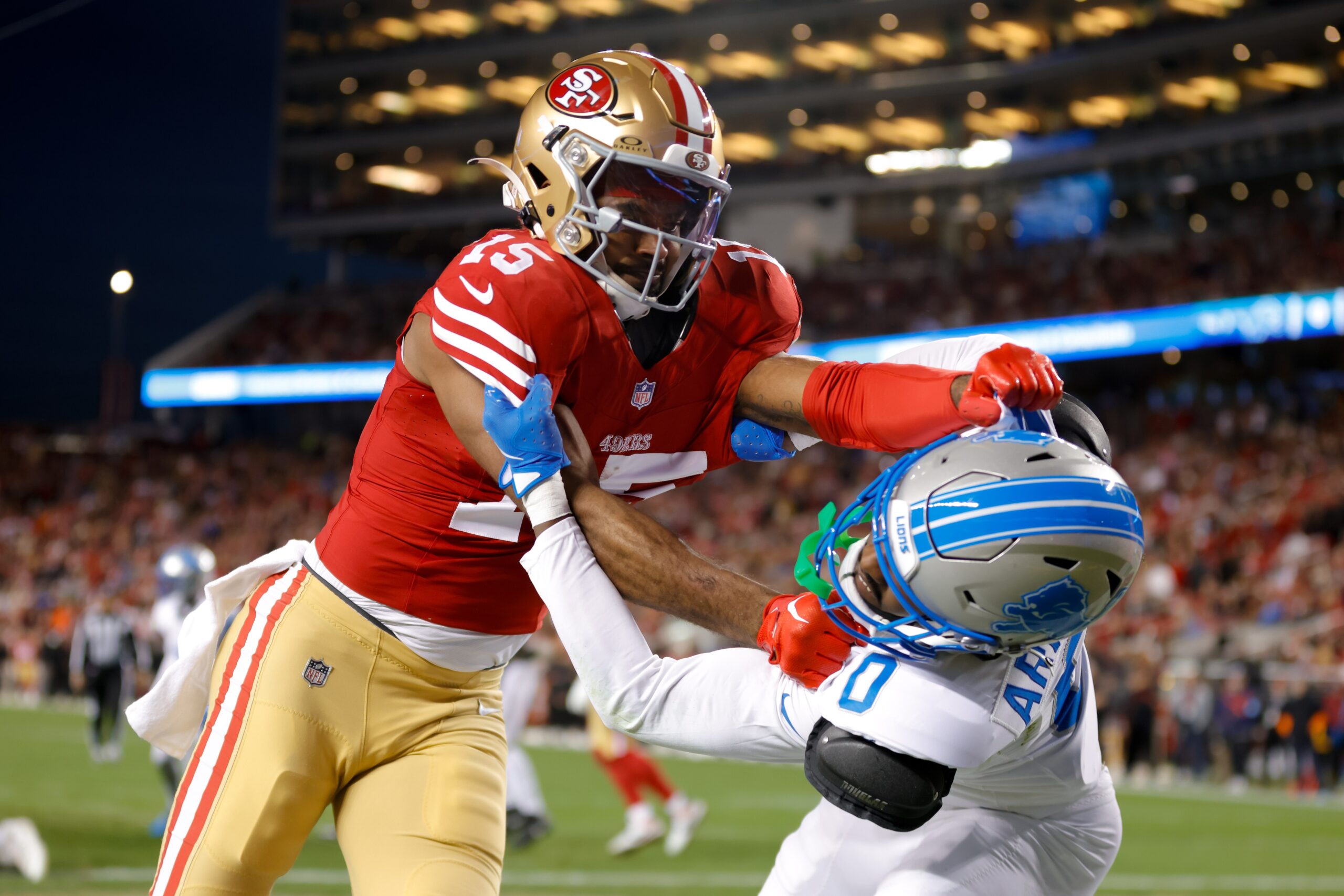 Dec 30, 2024; Santa Clara, California, USA; San Francisco 49ers wide receiver Jauan Jennings (15) and Detroit Lions cornerback Terrion Arnold (0) get tangled after a play during the first quarter at Levi's Stadium. Mandatory Credit: Sergio Estrada-Imagn Images