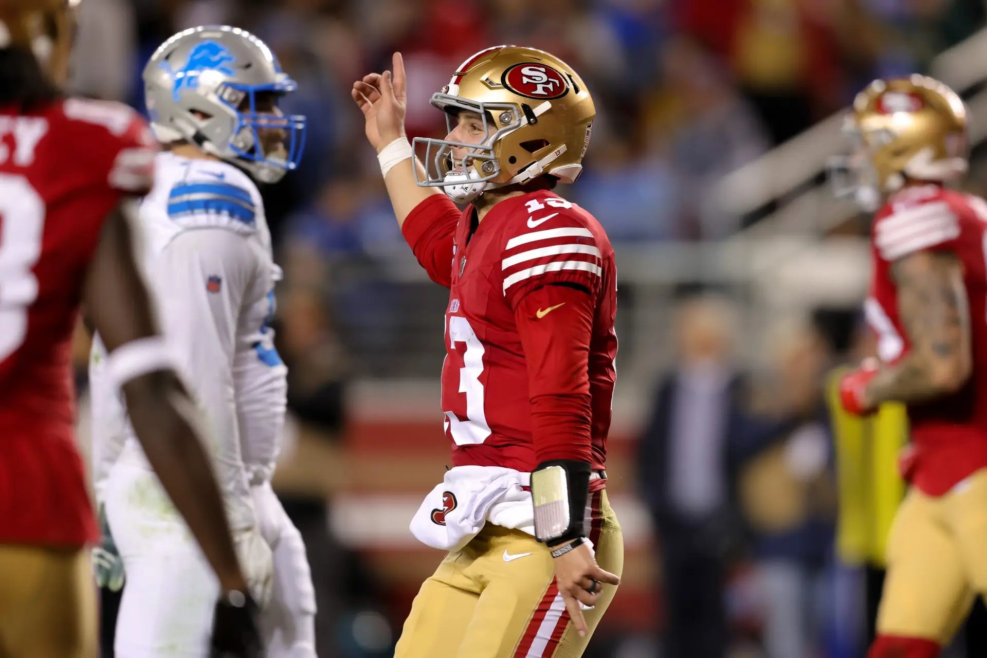 Dec 30, 2024; Santa Clara, California, USA; San Francisco 49ers quarterback Brock Purdy (13) celebrates after scoring a touchdown during the second quarter against the Detroit Lions at Levi's Stadium. Mandatory Credit: Sergio Estrada-Imagn Images