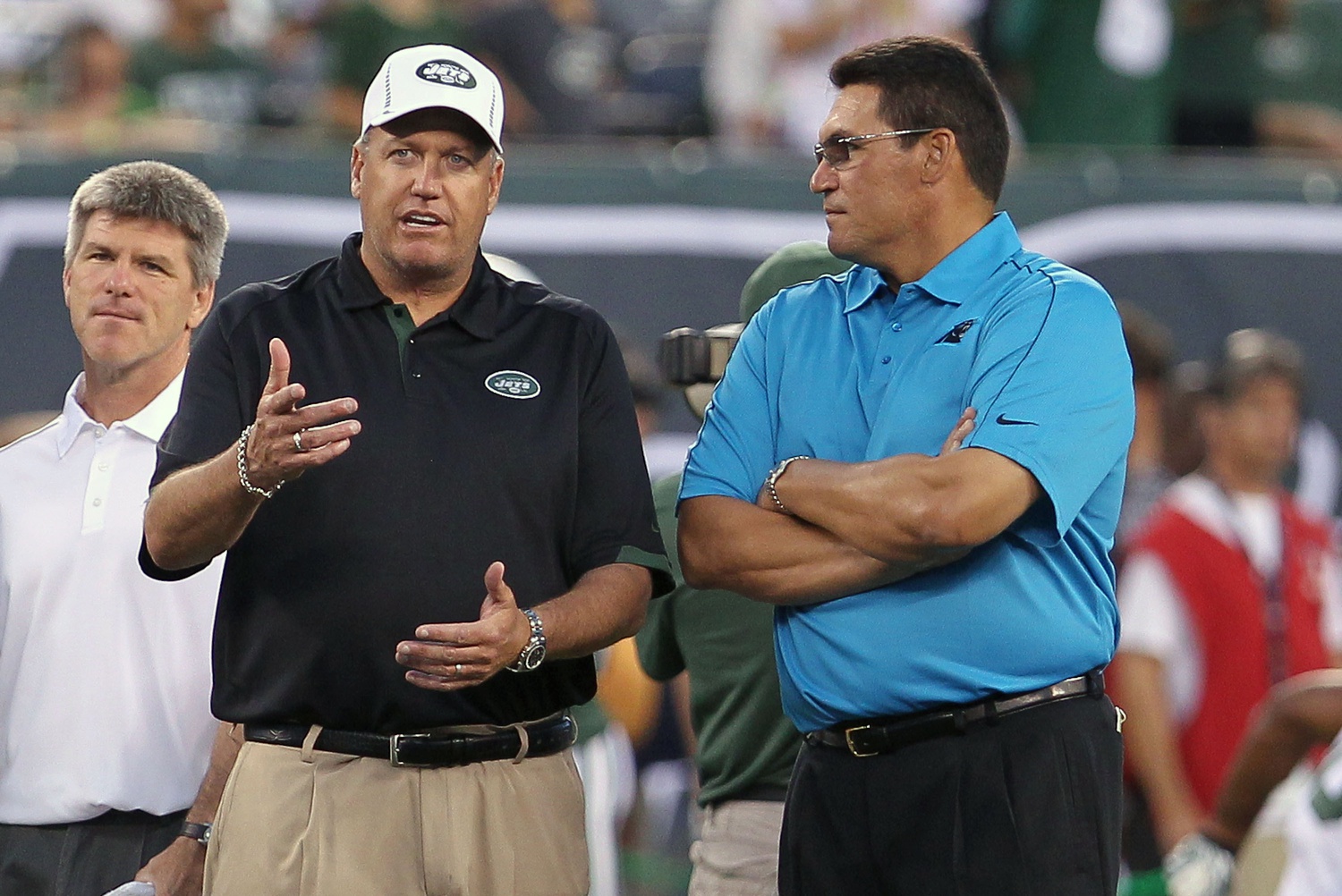 Aug 26, 2012; East Rutherford, NJ, USA; New York Jets head coach Rex Ryan and Carolina Panthers head coach Ron Rivera talk during warmups at MetLife Stadium. Mandatory Credit: Ed Mulholland-Imagn Images