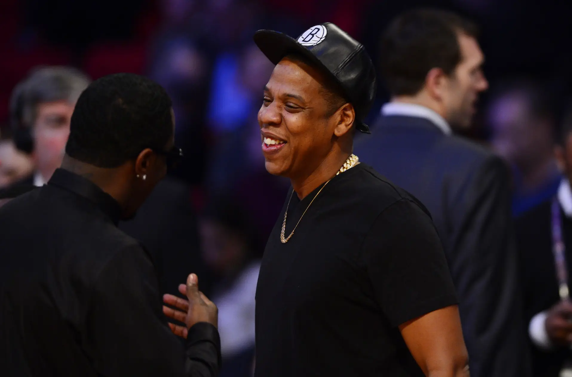 Feb 17, 2013; Houston, TX, USA; Recording artists Sean Combs (left) and Jay-Z greet each other before the 2013 NBA all star game at the Toyota Center. Mandatory Credit: Bob Donnan-Imagn Images NFL