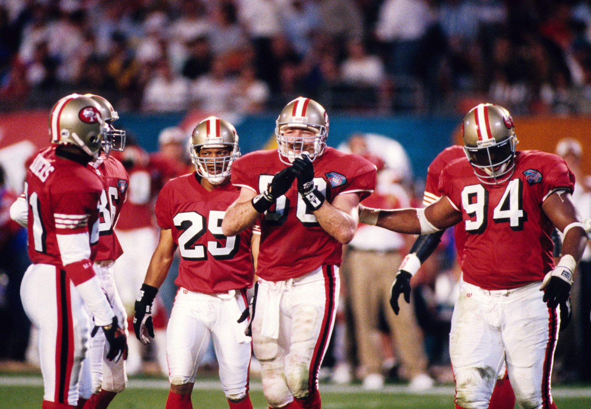 Jan 29, 1995; Miami, FL, USA; FILE PHOTO; San Francisco 49ers linebacker Gary Plummer (50), cornerback Deion Sanders (21), cornerback Eric Davis (25) and defensive tackle Dana Stubblefield (94) on the field against the San Diego Chargers during Super Bowl XXIX at Joe Robbie Stadium. The 49ers defeated the Chargers 49-26. Mandatory Credit: RVR Photos-USA TODAY NETWORK