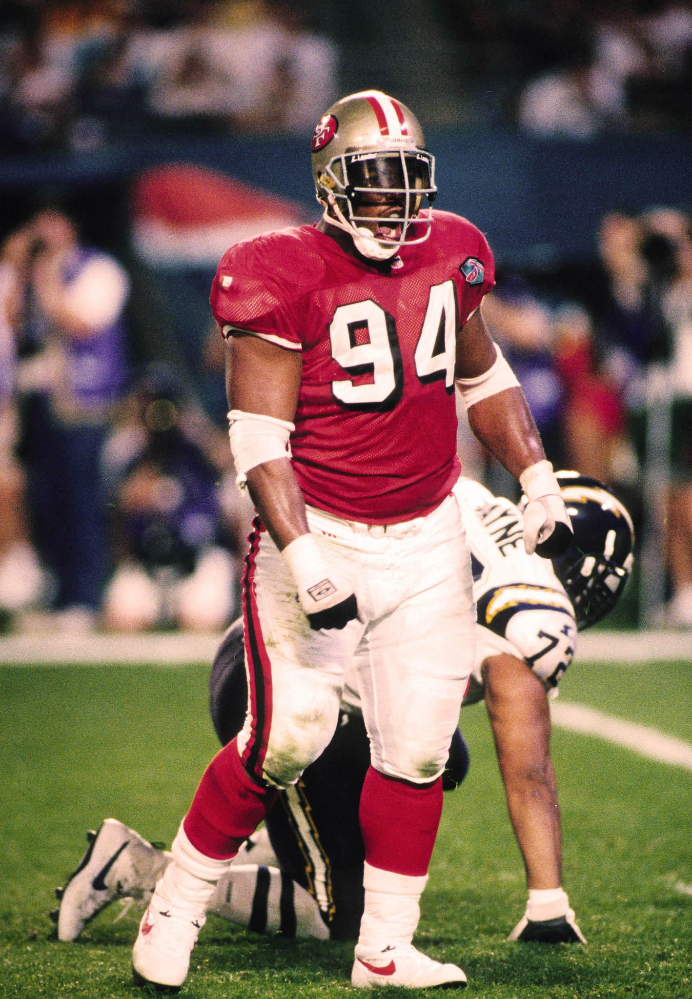 Jan 29, 1995; Miami, FL, USA; FILE PHOTO; San Francisco 49ers defensive tackle Dana Stubblefield (94) reacts on the field against San Diego Chargers tackle Harry Swayne (72) during Super Bowl XXIX at Joe Robbie Stadium. The 49ers defeated the Chargers 49-26. Mandatory Credit: RVR Photos-USA TODAY NETWORK