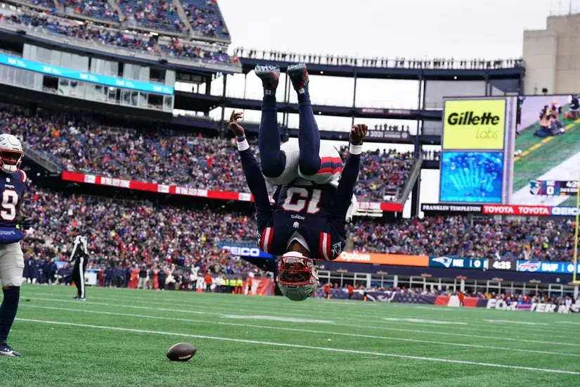 Jan 5, 2025; Foxborough, Massachusetts, USA; New England Patriots quarterback Joe Milton III (19) reacts after runs the ball for a touchdown against the Buffalo Bills in the first quarter at Gillette Stadium. Mandatory Credit: David Butler II-Imagn Images