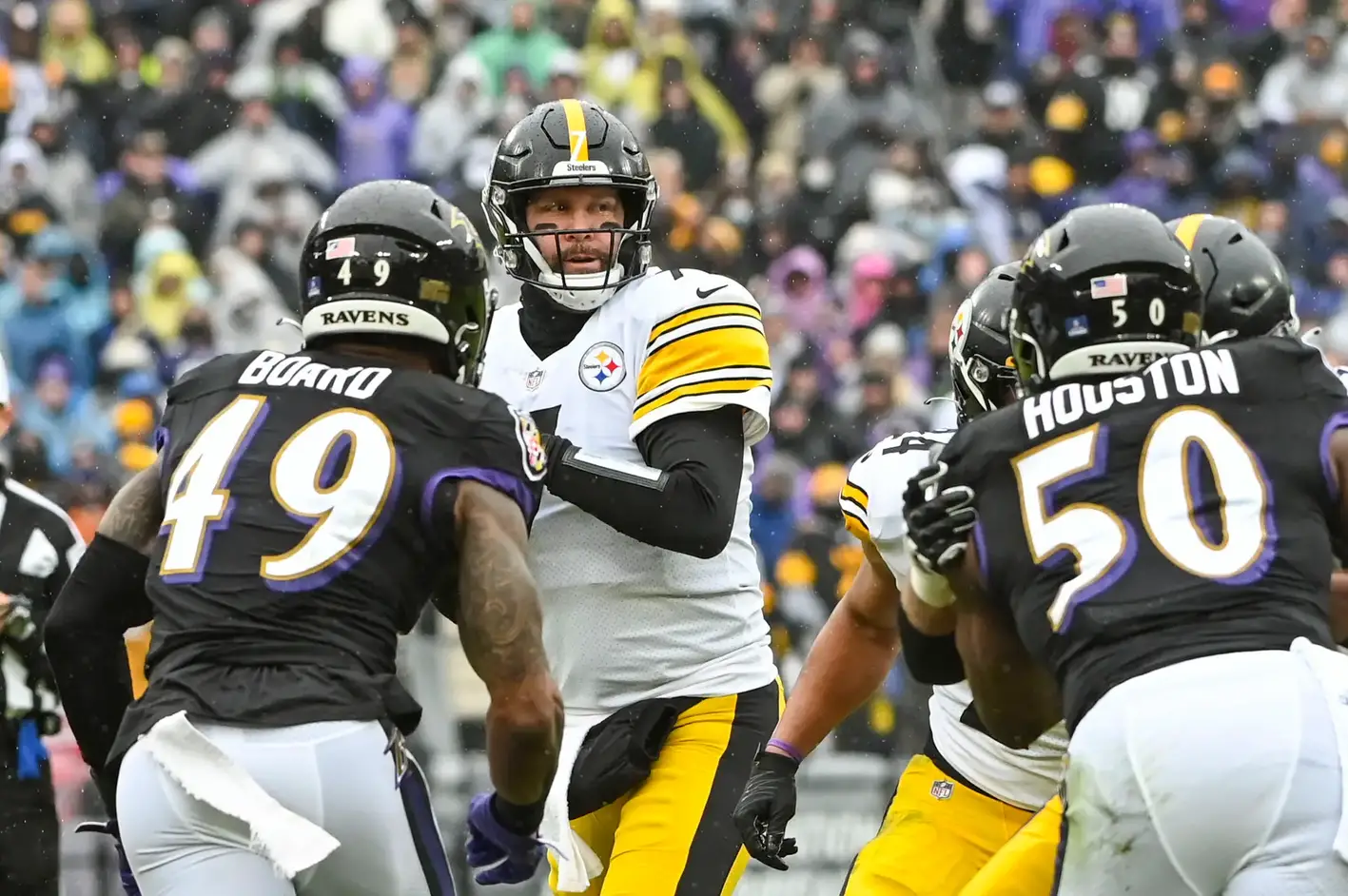 Jan 9, 2022; Baltimore, Maryland, USA; Pittsburgh Steelers quarterback Ben Roethlisberger (7) drops back to pass as Baltimore Ravens linebacker Chris Board (49) and outside linebacker Justin Houston (50) aplly pressure during the first quarter at M&T Bank Stadium. Mandatory Credit: Tommy Gilligan-Imagn Images