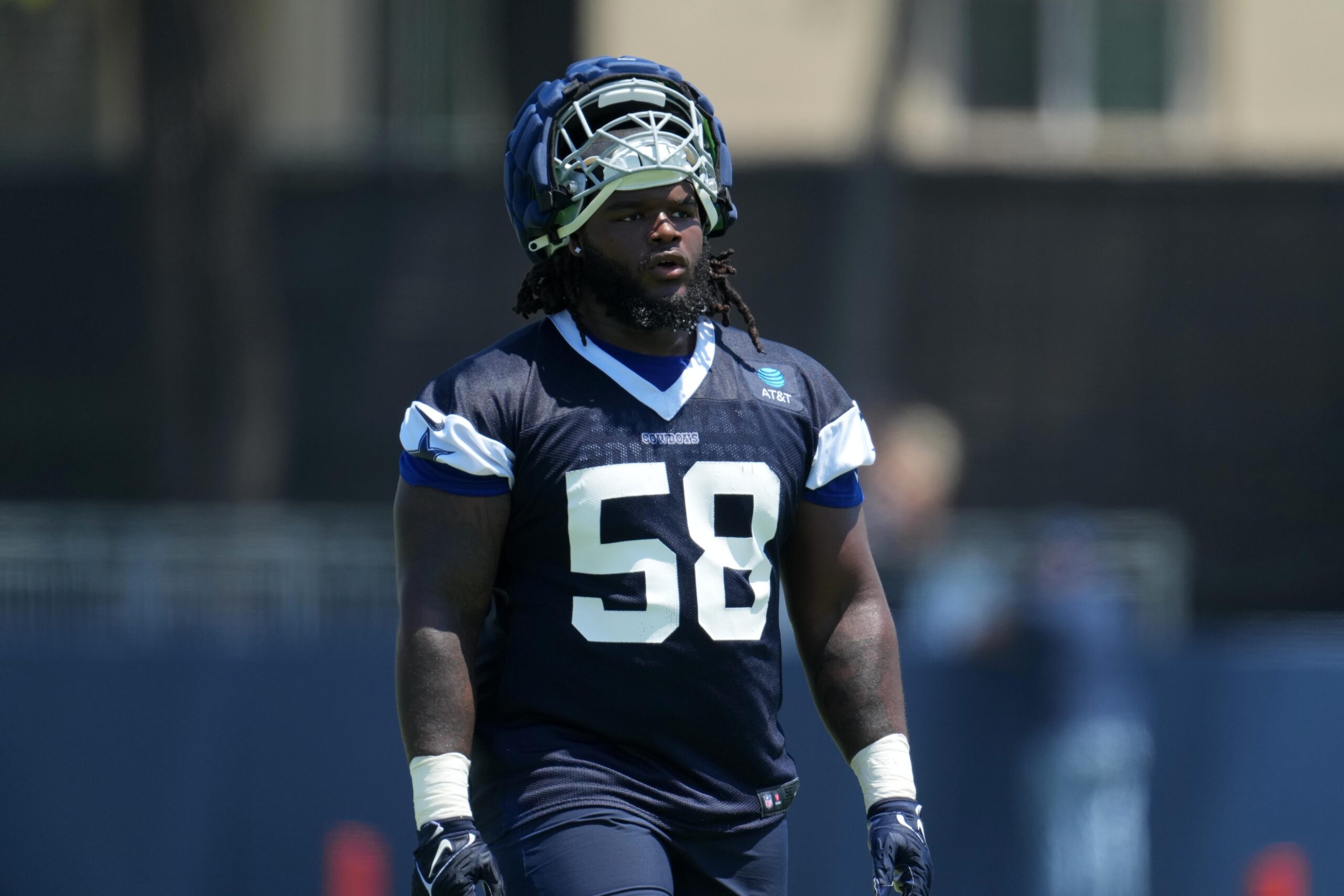 Jul 29, 2023; Oxnard, CA, USA; Dallas Cowboys defensive tackle Mazi Smith (58) wears a Guardian helmet cap during training camp at the River Ridge Fields. Mandatory Credit: Kirby Lee-Imagn Images