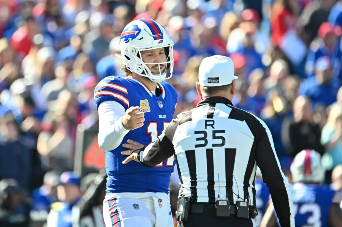 Oct 20, 2024; Orchard Park, New York, USA; Buffalo Bills quarterback Josh Allen (17) talks with referee John Hussey (35) in the first quarter at Highmark Stadium. Mandatory Credit: Mark Konezny-Imagn Images