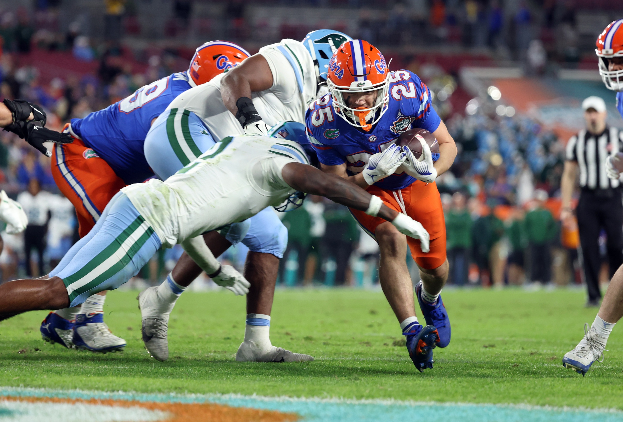 Dec 20, 2024; Tampa, FL, USA; Florida Gators running back Anthony Rubio (25) runs the ball in for a touchdown against the Tulane Green Wave during the second half at Raymond James Stadium. Mandatory Credit: Kim Klement Neitzel-Imagn Images