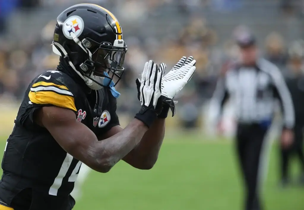 Dec 25, 2024; Pittsburgh, Pennsylvania, USA; Pittsburgh Steelers wide receiver George Pickens (14) reacts after a Kansas City Chiefs penalty during the fourth quarter at Acrisure Stadium. Mandatory Credit: Charles LeClaire-Imagn Images