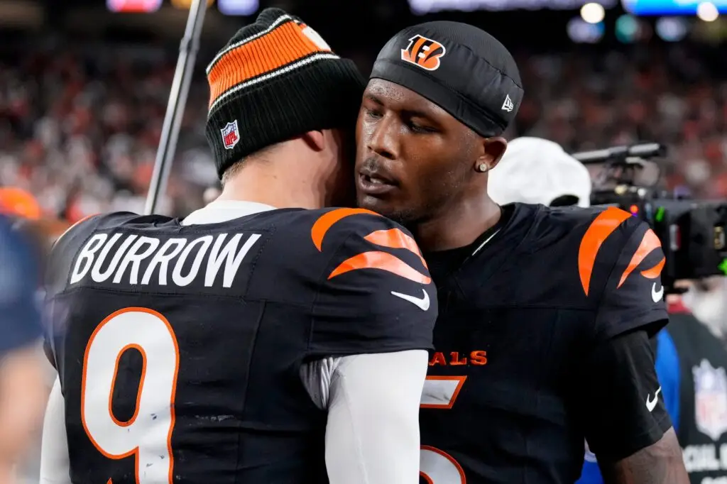 Cincinnati Bengals quarterback Joe Burrow (9) and wide receiver Tee Higgins (5) celebrate the win after overtime of the NFL Week 17 game between the Cincinnati Bengals and the Denver Broncos at Paycor Stadium in downtown Cincinnati on Saturday, Dec. 28, 2024. The Bengals took a 30-24 win in overtime to remain in the post season chase.