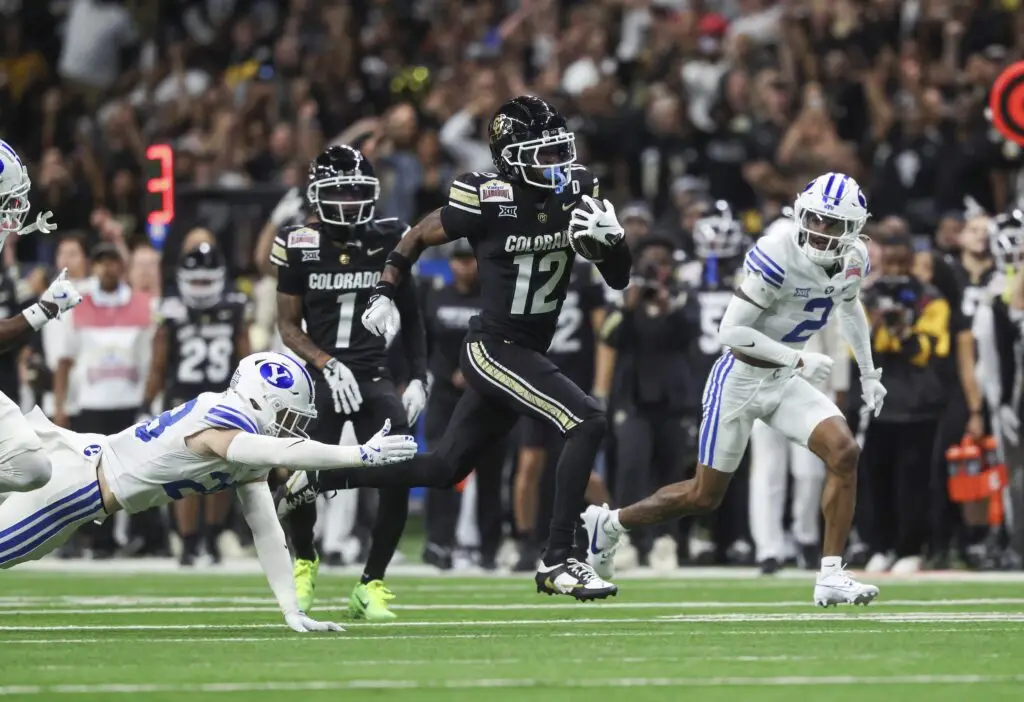 Colorado Buffaloes wide receiver Travis Hunter (12) runing with the ball against the Brigham Young Cougars