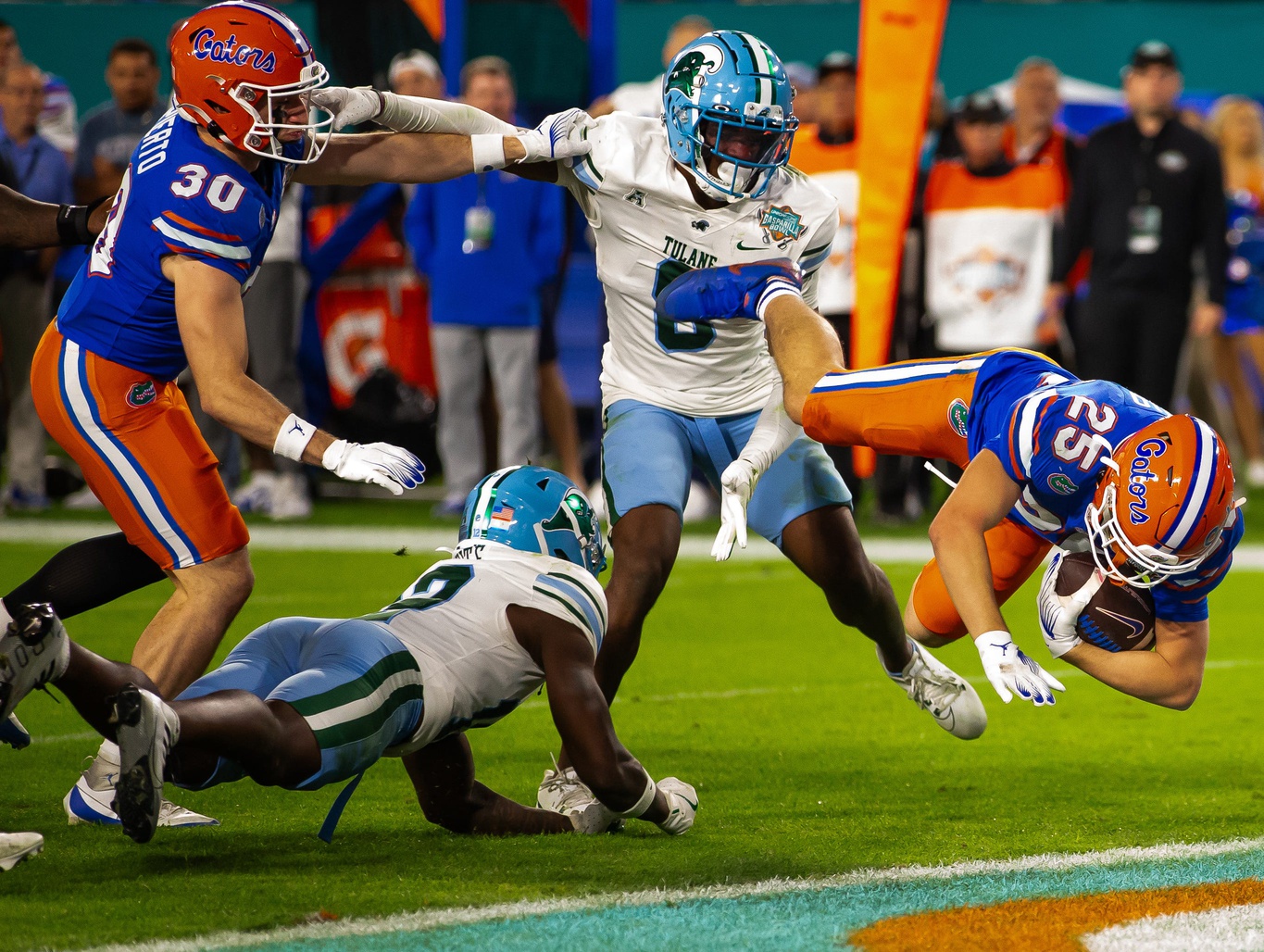 Florida Gators running back Anthony Rubio (25) dives into the end zone for a touchdown during the second half at Raymond James Stadium in Tampa, FL on Friday, December 20, 2024 in the 2024 Union Home Mortgage Gasparilla Bowl. The Gators defeated Tulane 33-8. [Doug Engle/Gainesville Sun]